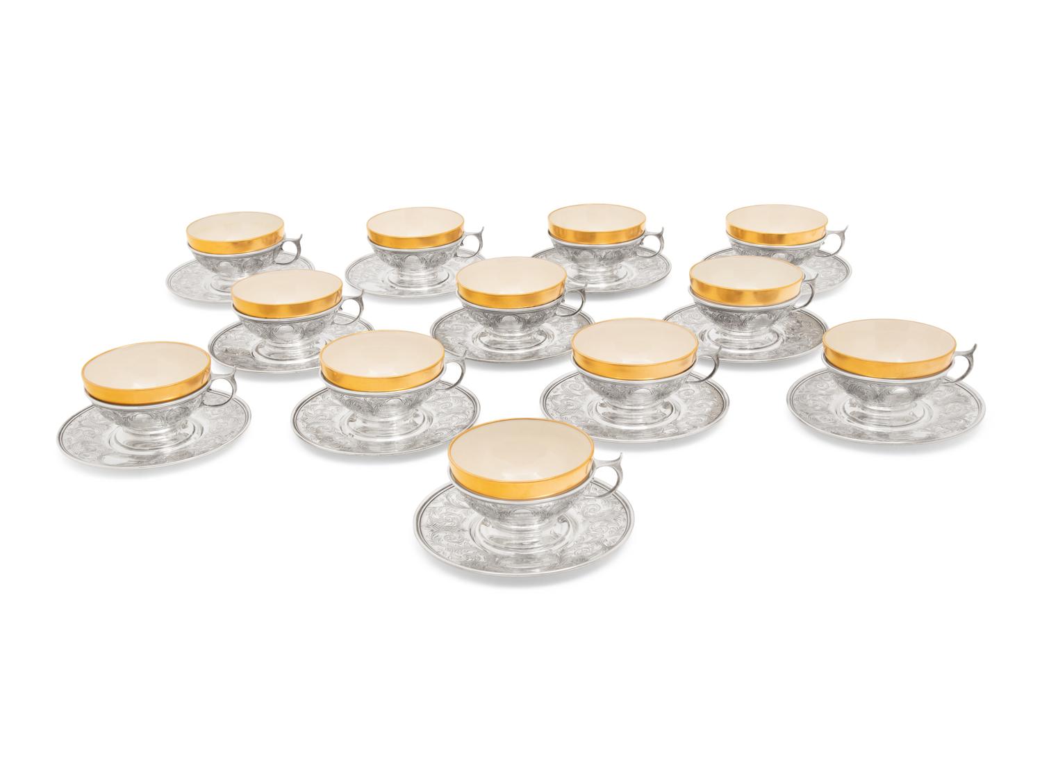 A Set of Twelve American Silver Teacups and Saucers