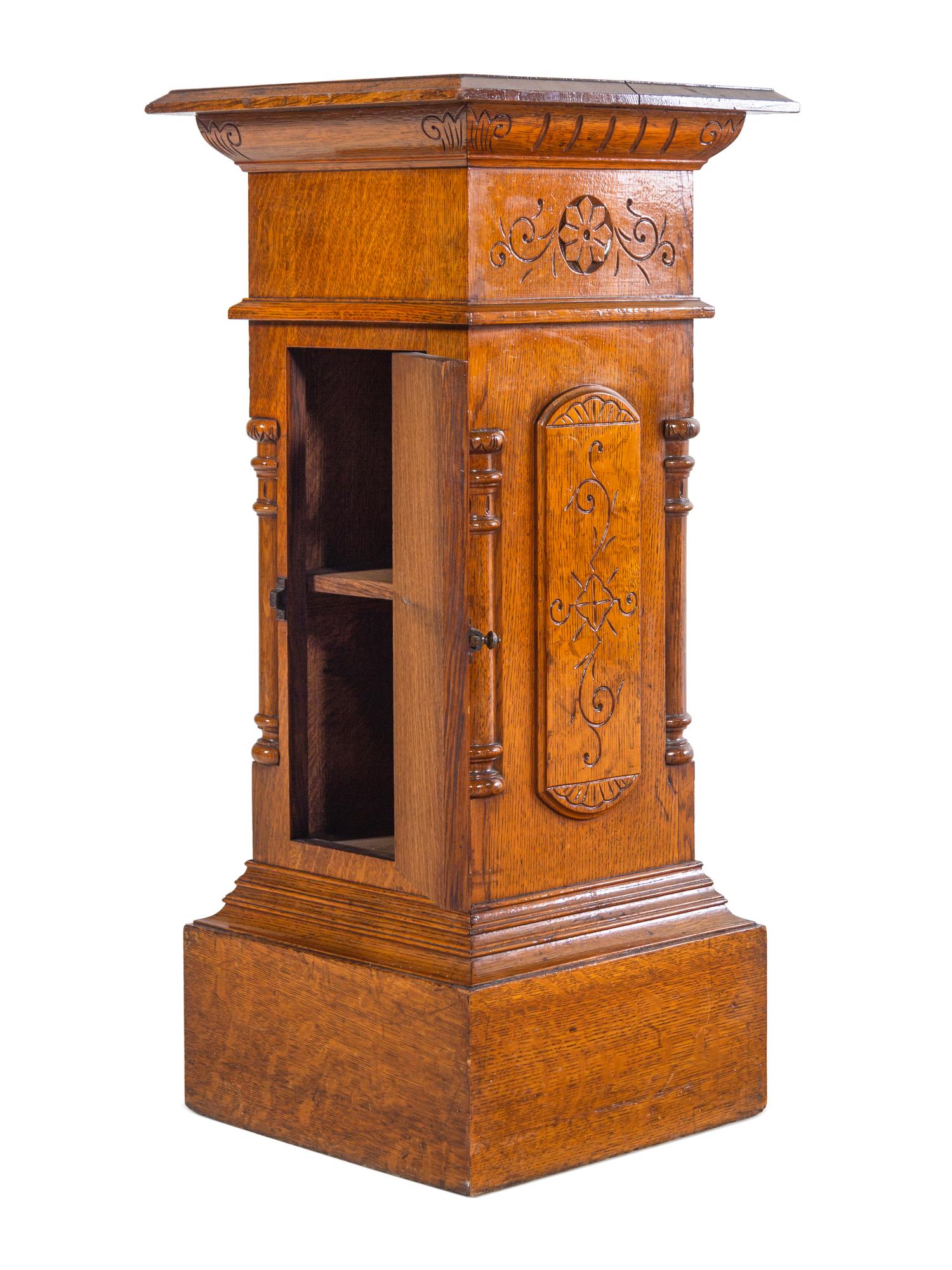 An Aesthetic Movement Carved Oak Pedestal