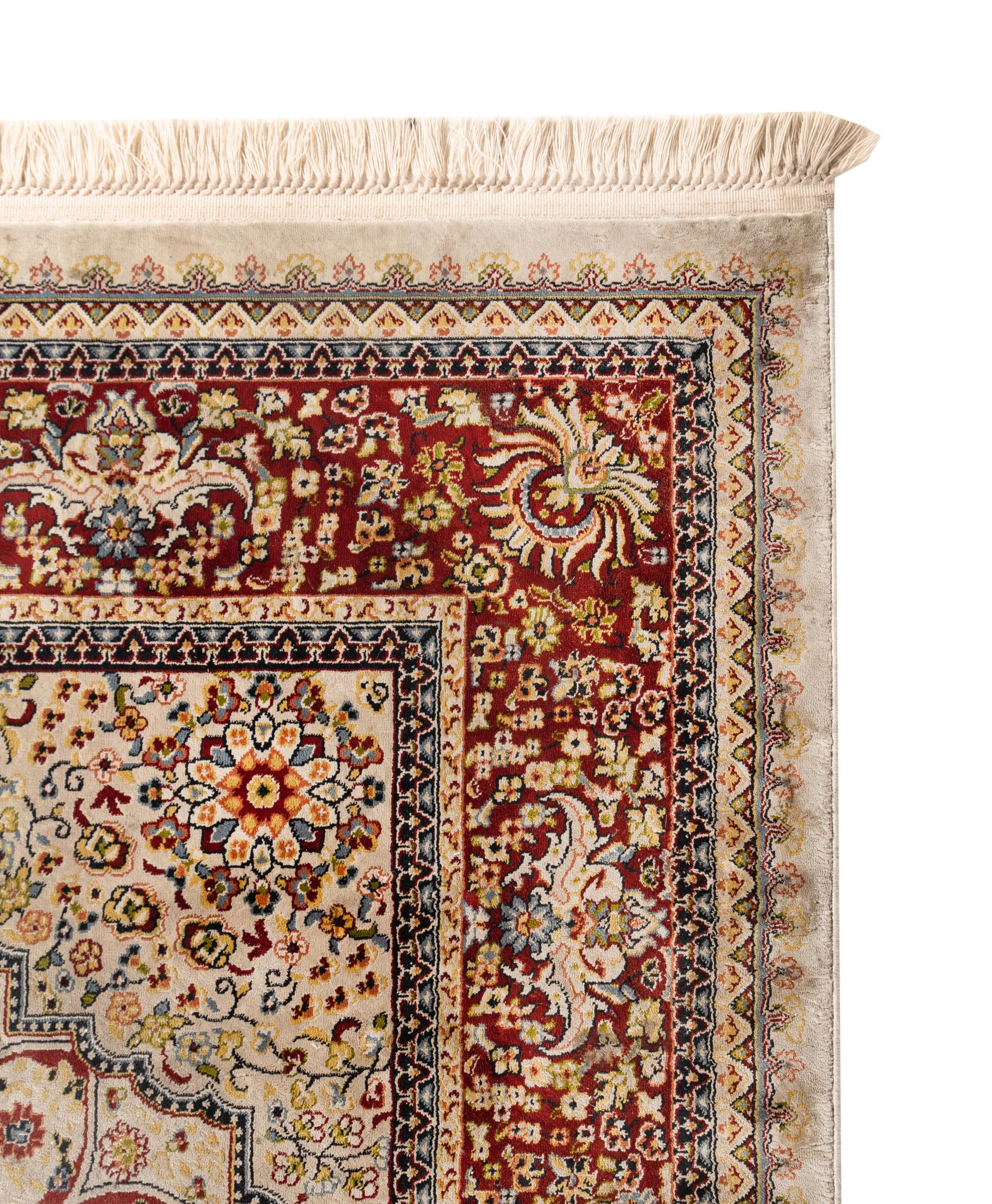 A Qom Wool and Silk Rug