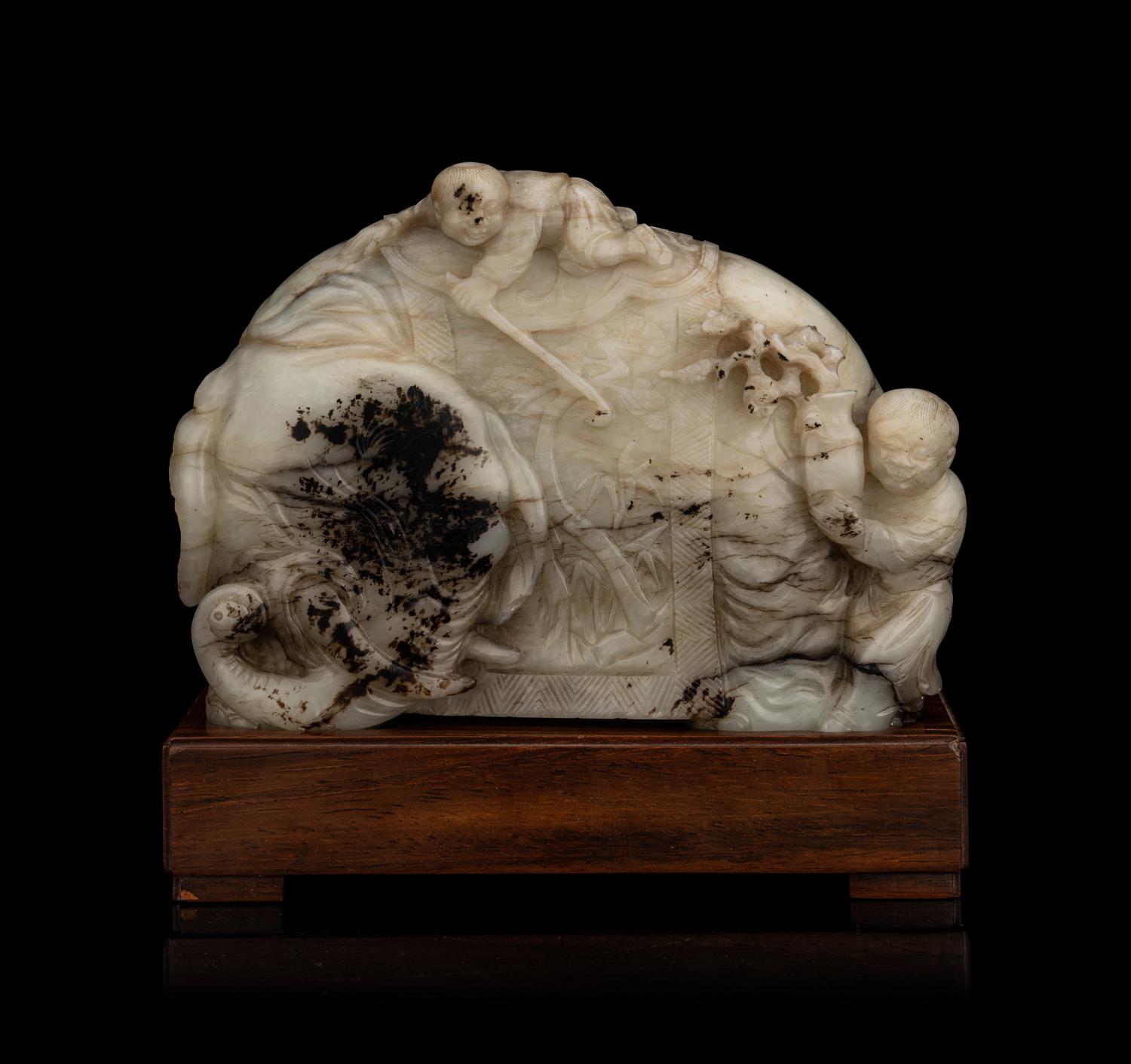 A Carved Jade ‘Elephant and Children’ Figural Group