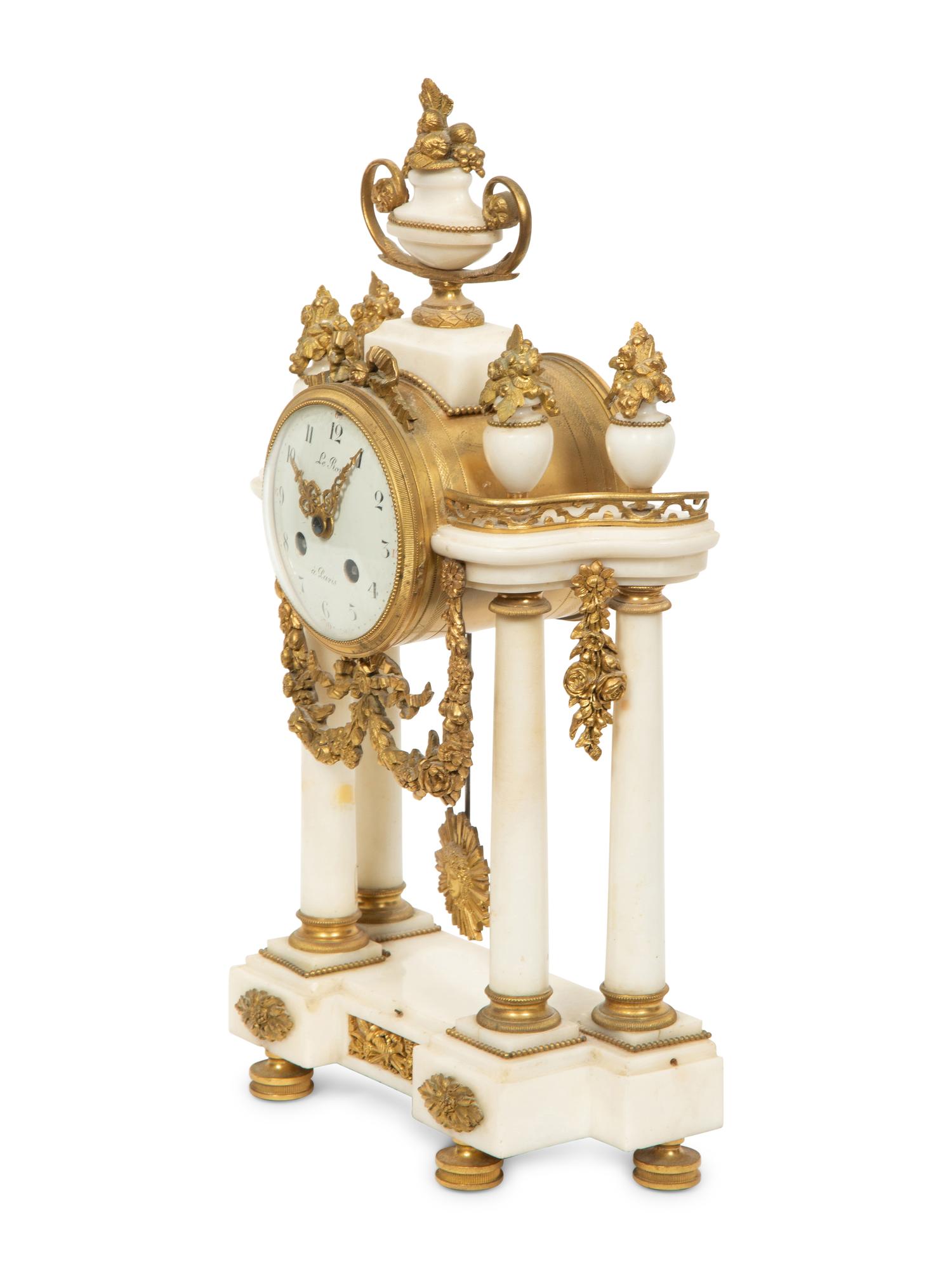 An Empire Style Gilt Bronze Mounted Marble Portico Clock