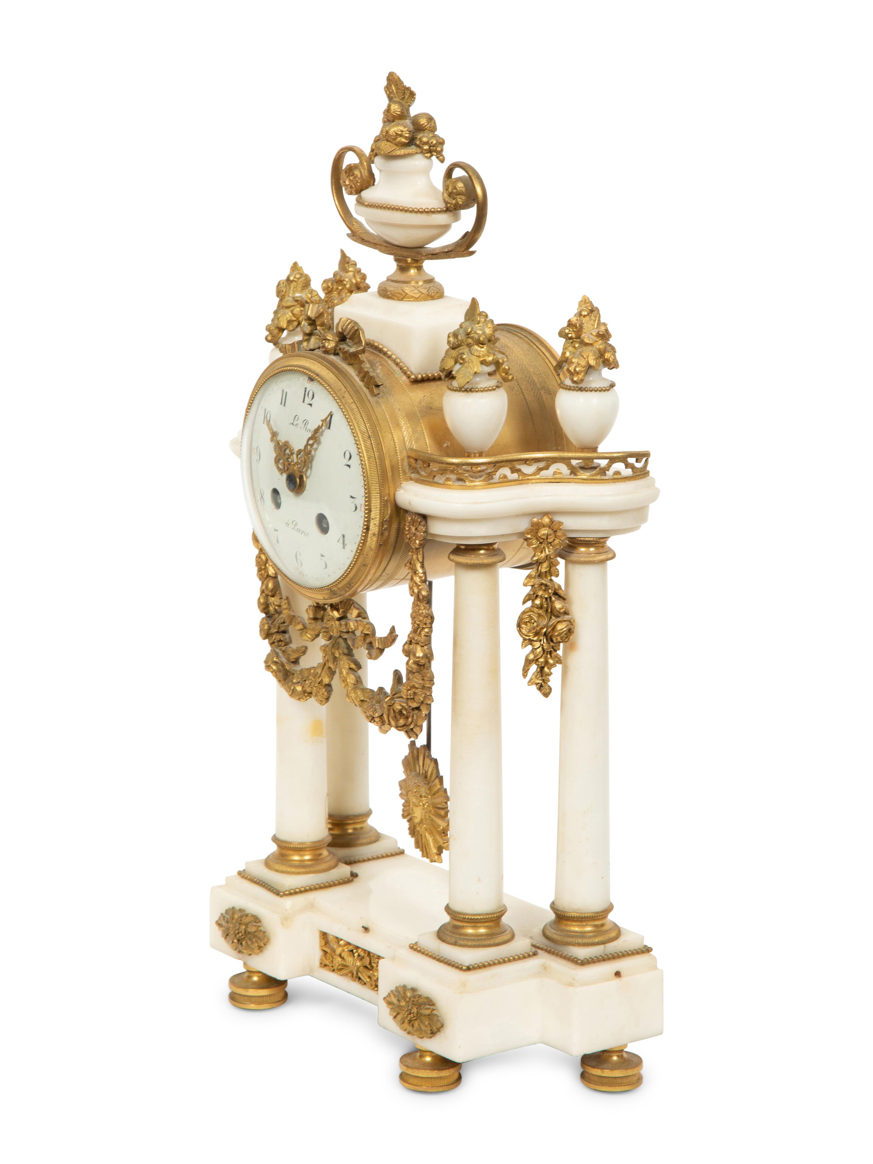 An Empire Style Gilt Bronze Mounted Marble Portico Clock