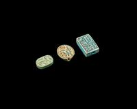 Two Egyptian Faience Seals and an Inscribed Bead