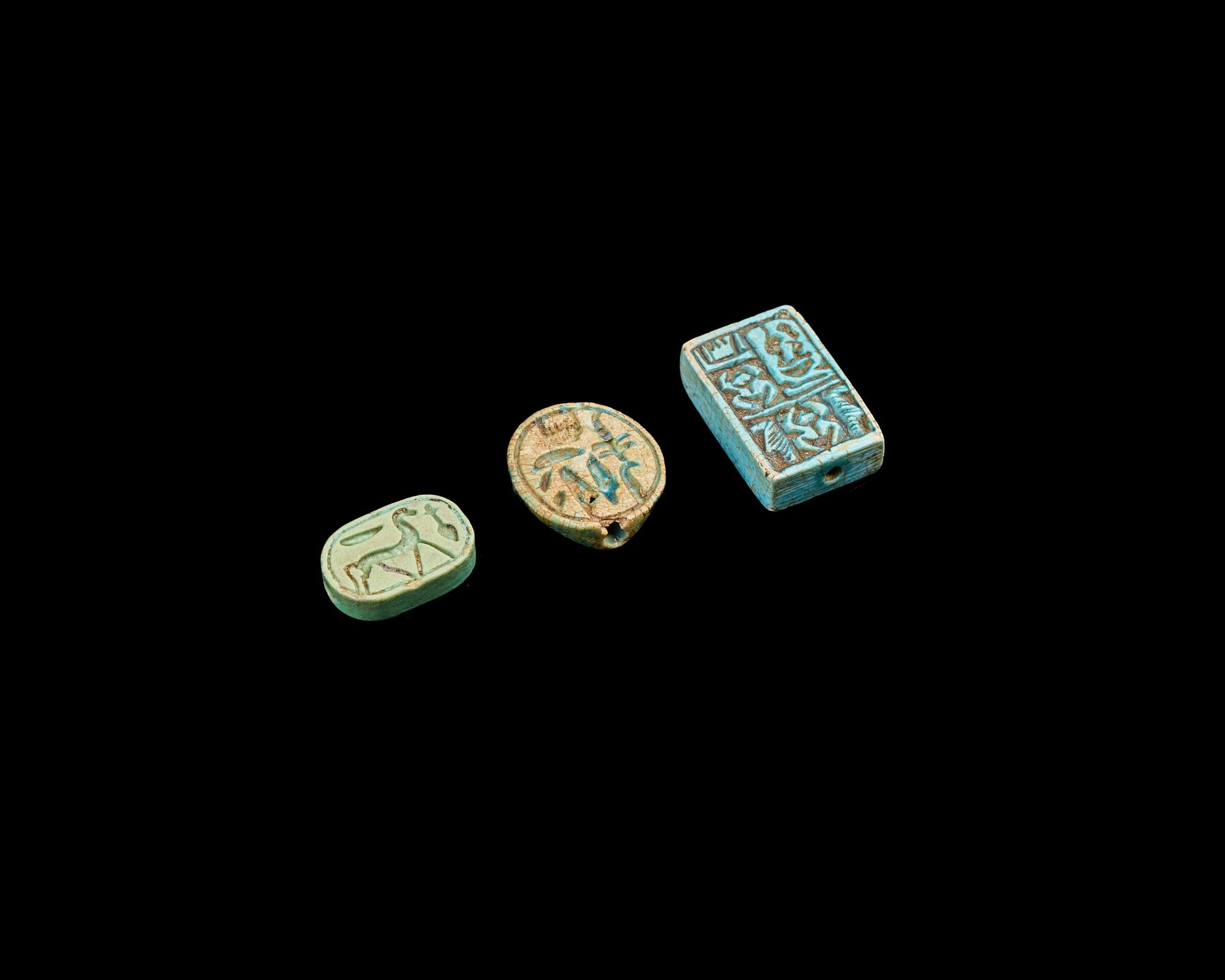 Two Egyptian Faience Seals and an Inscribed Bead