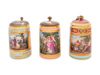 Three Vienna Painted and Parcel Gilt Porcelain Tankards