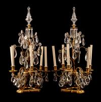 A Pair of Louis XV Style Gilt Bronze and Cut Glass Five-Light Girandoles