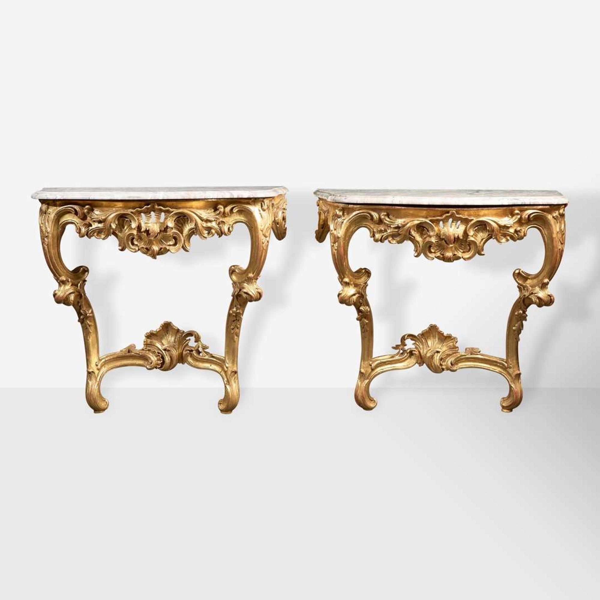 A pair of Louis XV carved giltwood consoles with breccia marble tops 18th century and possibly later