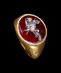 A Hellenistic Gold and Garnet Finger Ring with the God Eros