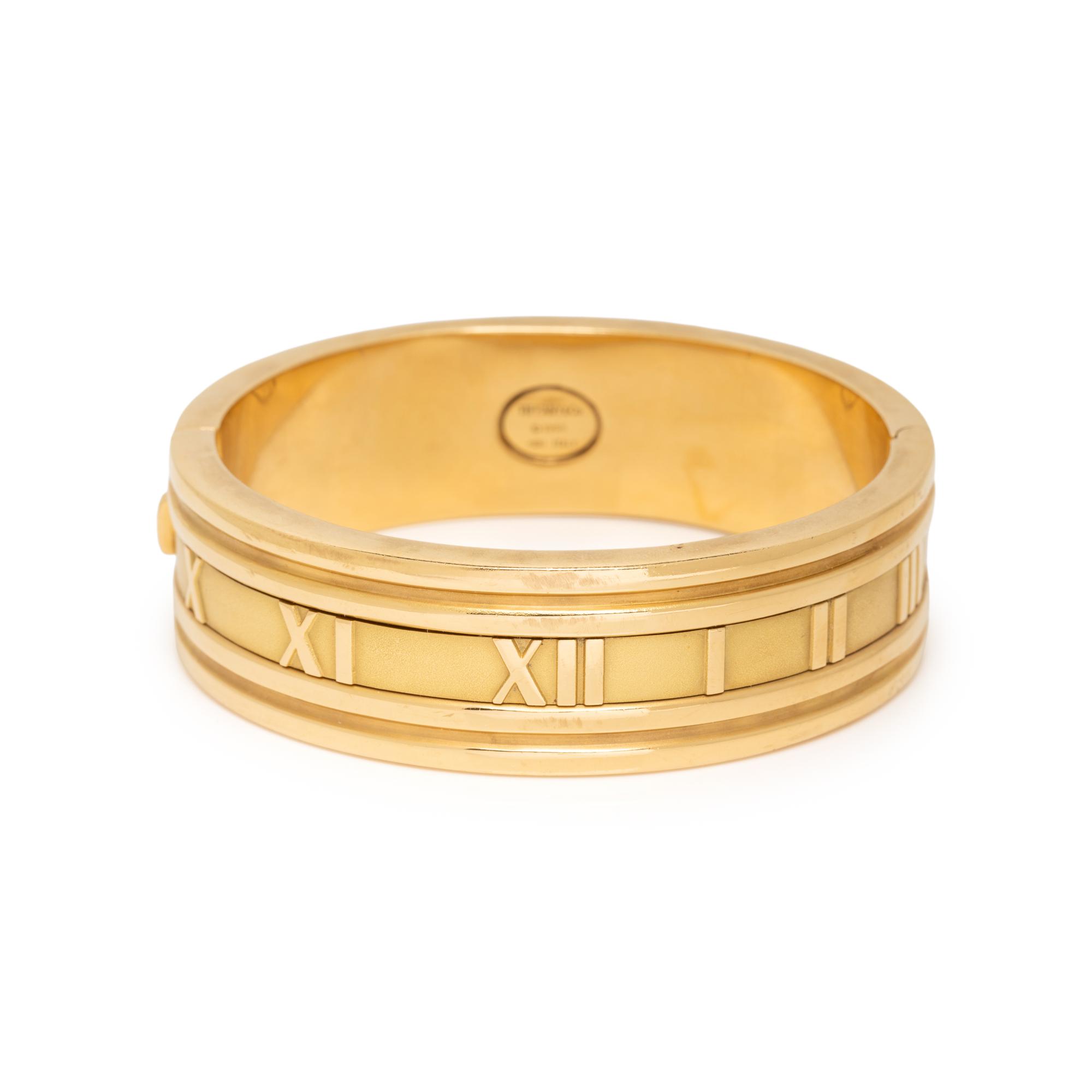 TIFFANY & CO., YELLOW GOLD 'ATLAS' HINGED BANGLE BRACELET