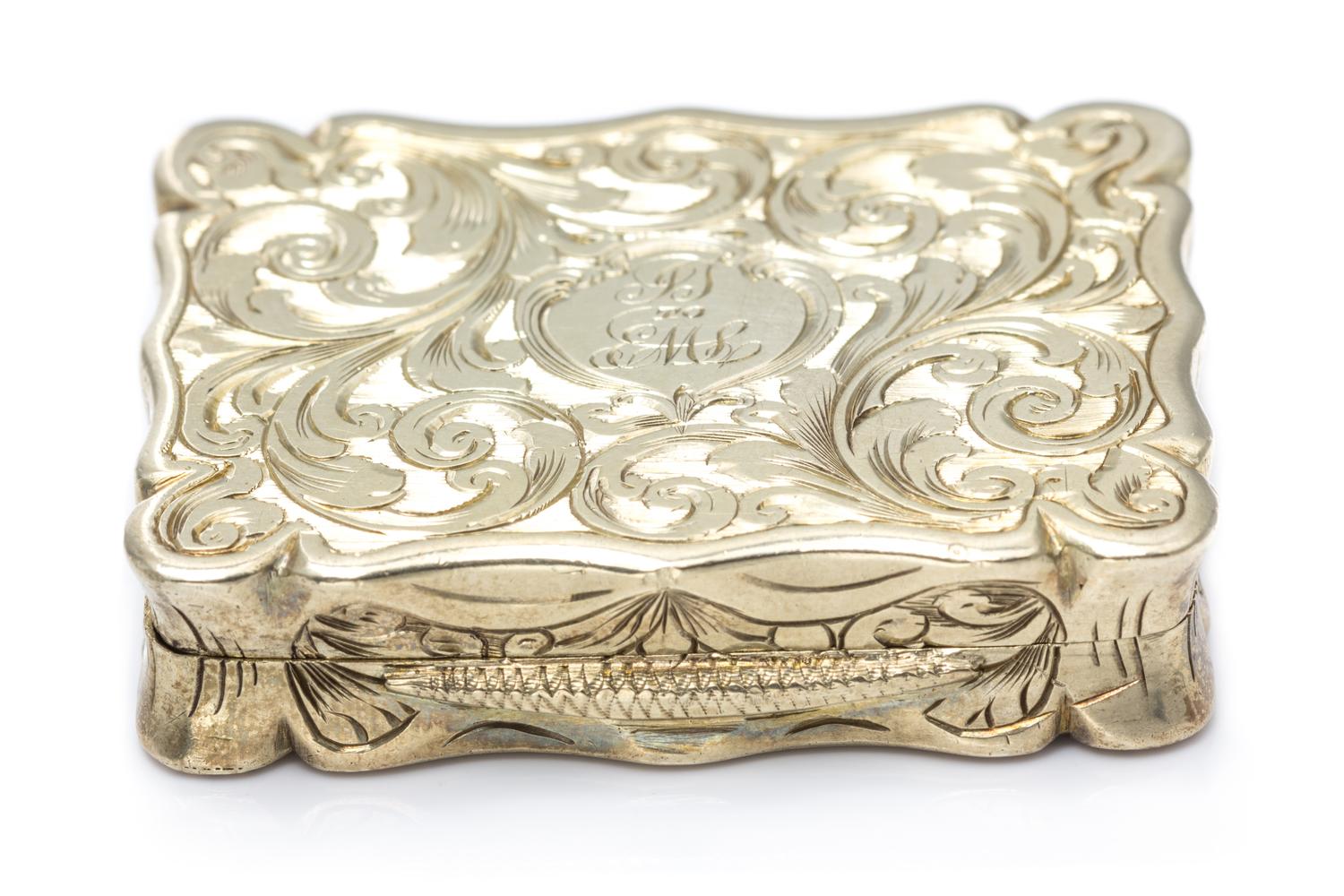 A Victorian Silver-Gilt Vinaigrette, Edward Smith, Birmingham, 1847, the lid decorated with a river scene, the underside centered by a