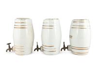 Three English Parcel-Gilt Porcelain Counter Top Liquor Dispensers