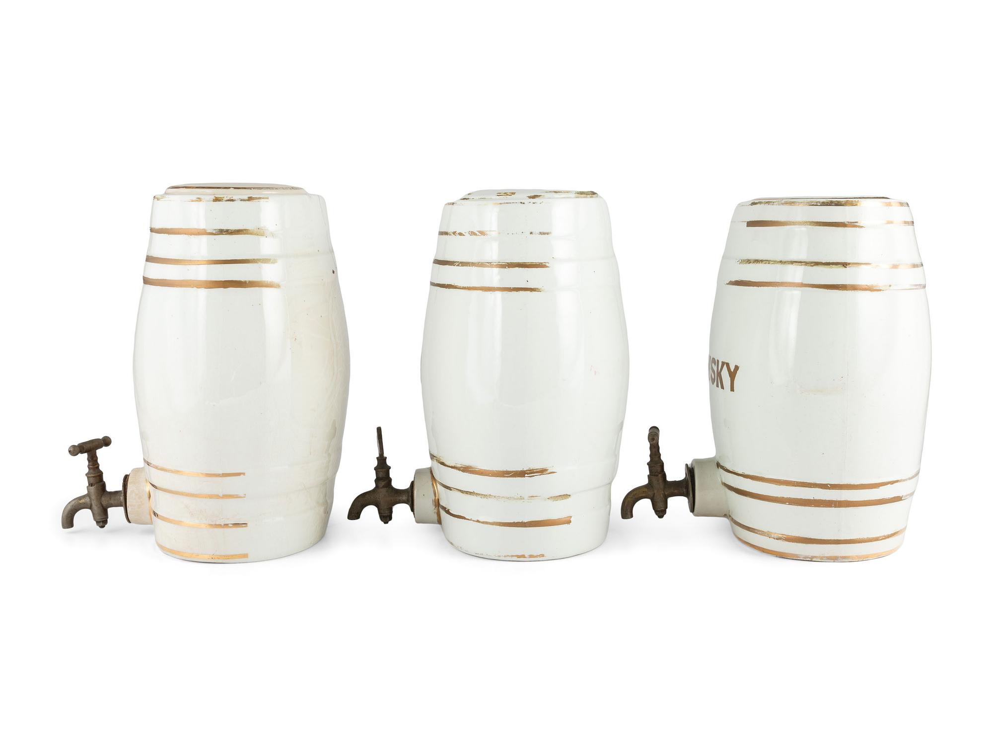 Three English Parcel-Gilt Porcelain Counter Top Liquor Dispensers