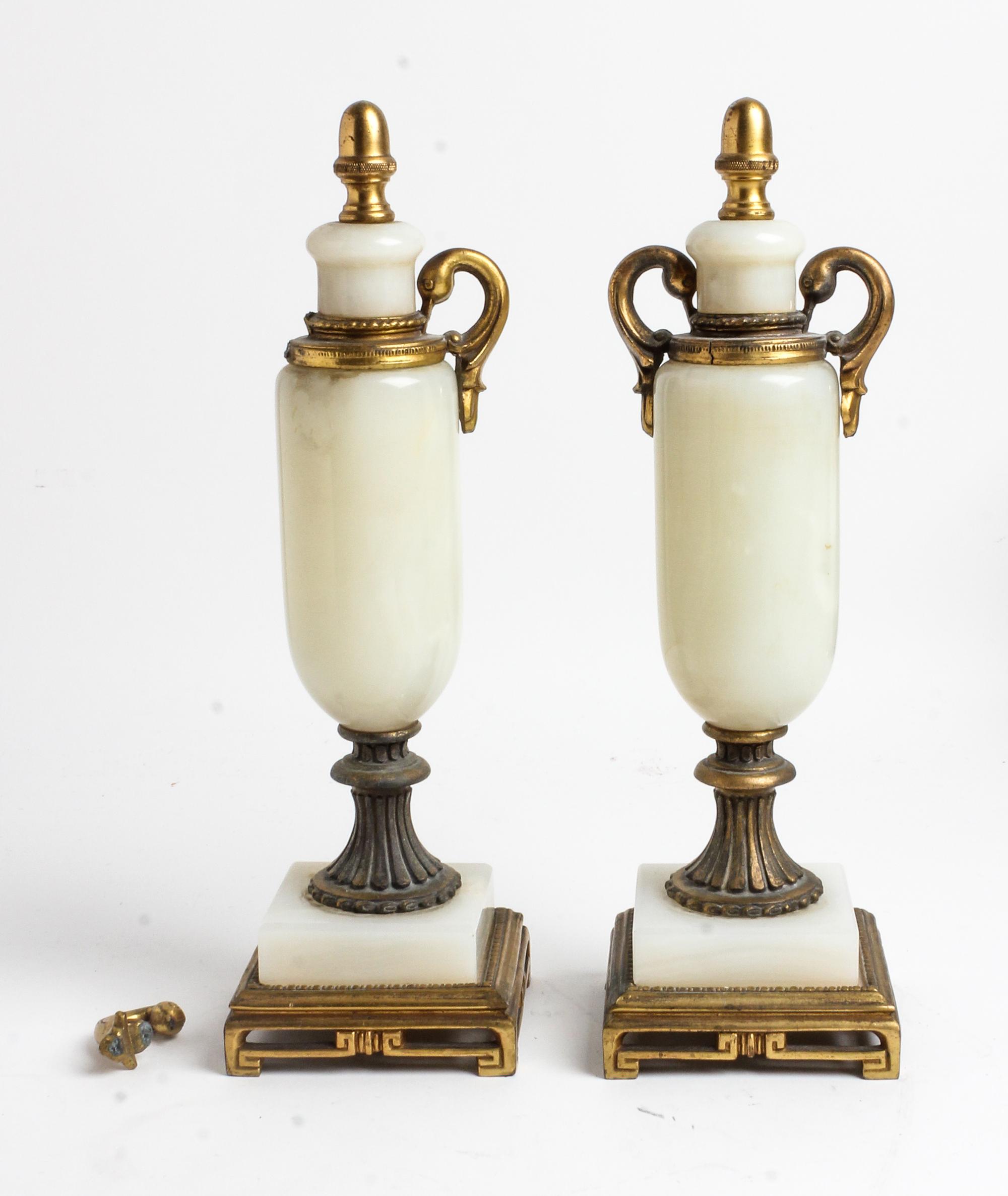 A Pair of Gilt Metal and Onyx Ornaments Height 13 inches. — 20TH CENTURY