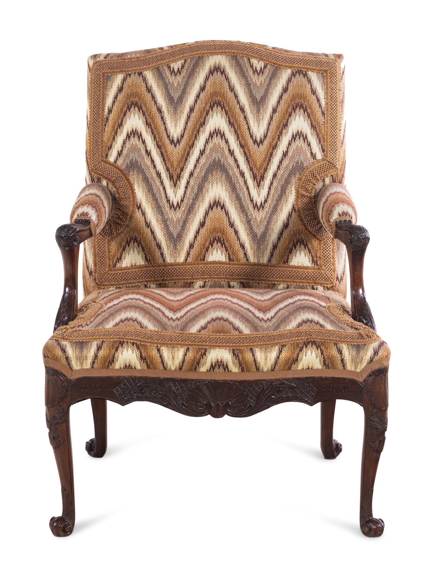 A Régence Style Carved Walnut Fauteuil