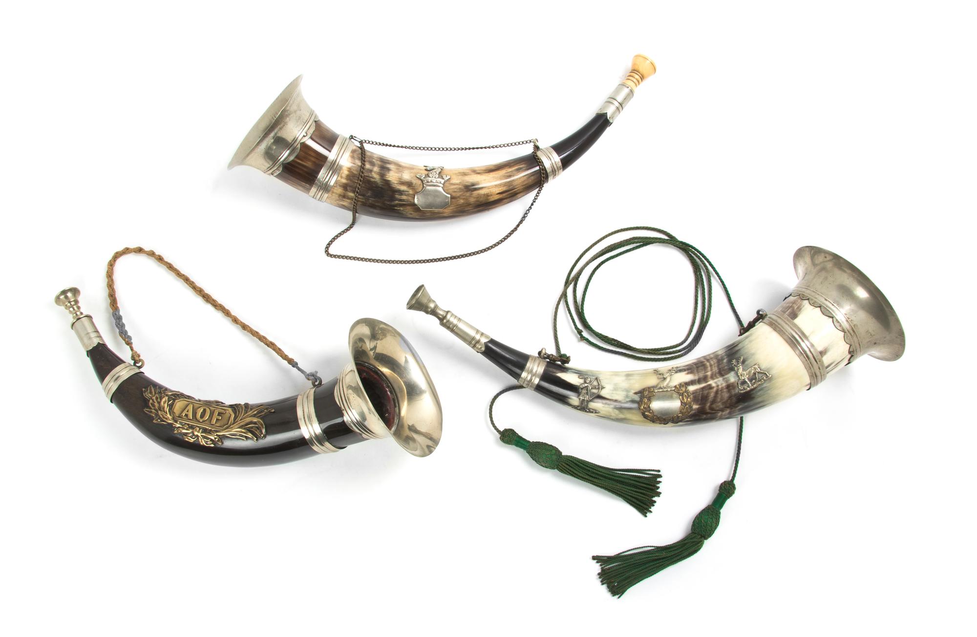A Collection of Three Silvered Metal Mounted Hunting Horns, Length of longest 14 1/2 inches.