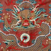 A Chinese Brown Ground Kesi Silk 'Dragon' Robe, Jifu, 19th Century 清晚期 醬地緙絲雲龍紋吉服