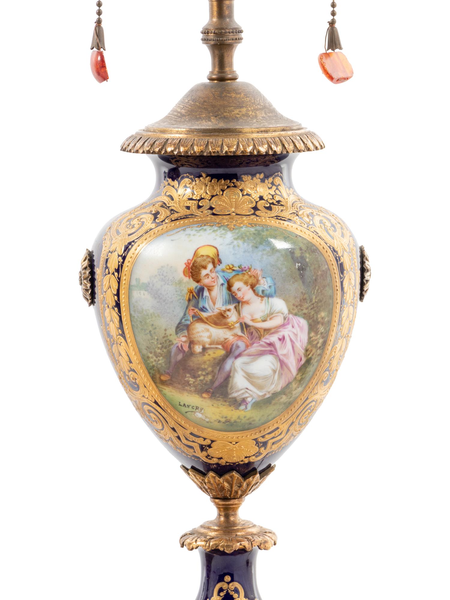 A Pair of Sèvres Style Porcelain Urns Mounted as Lamps