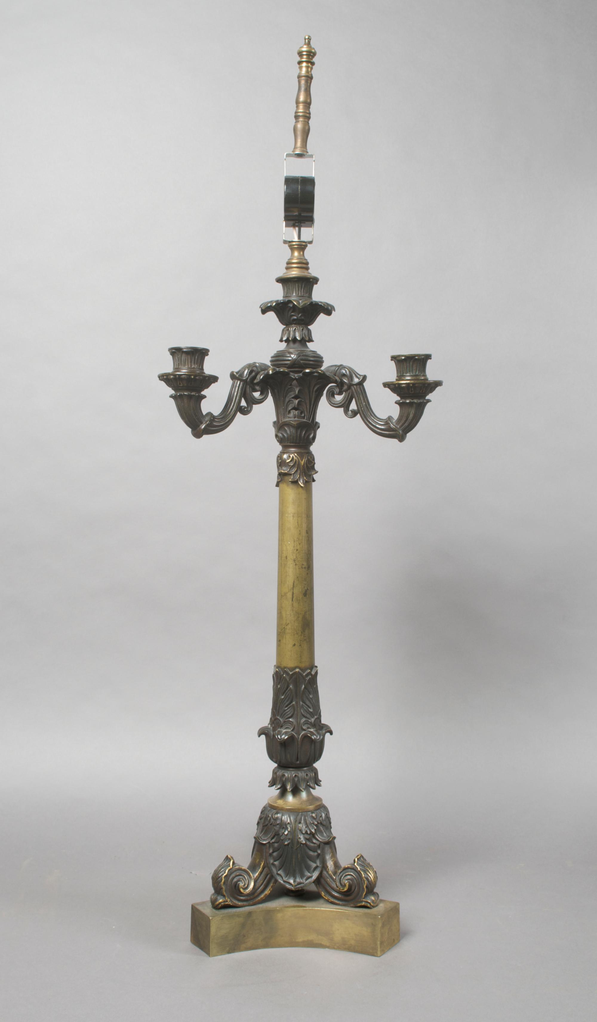 A Neoclassical Bronze Four-Light Candelabra, Height overall 33 inches.