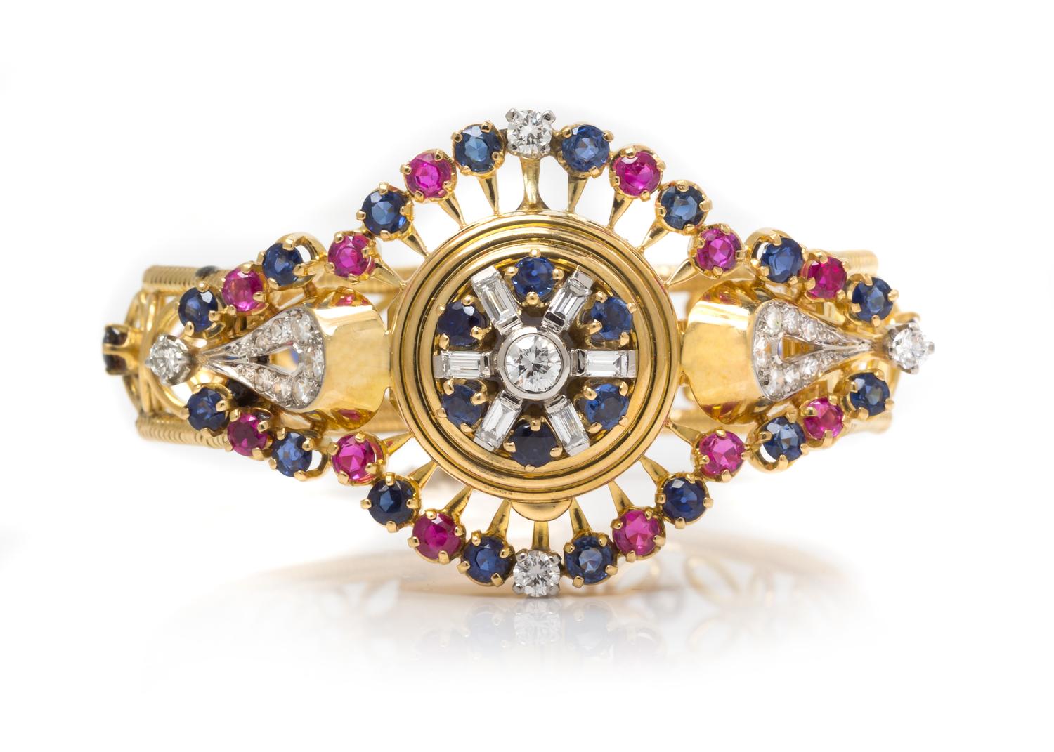 An 18 Karat Yellow Gold, Diamond, Sapphire and Ruby Surprise Wristwatch, 29.30 dwts.