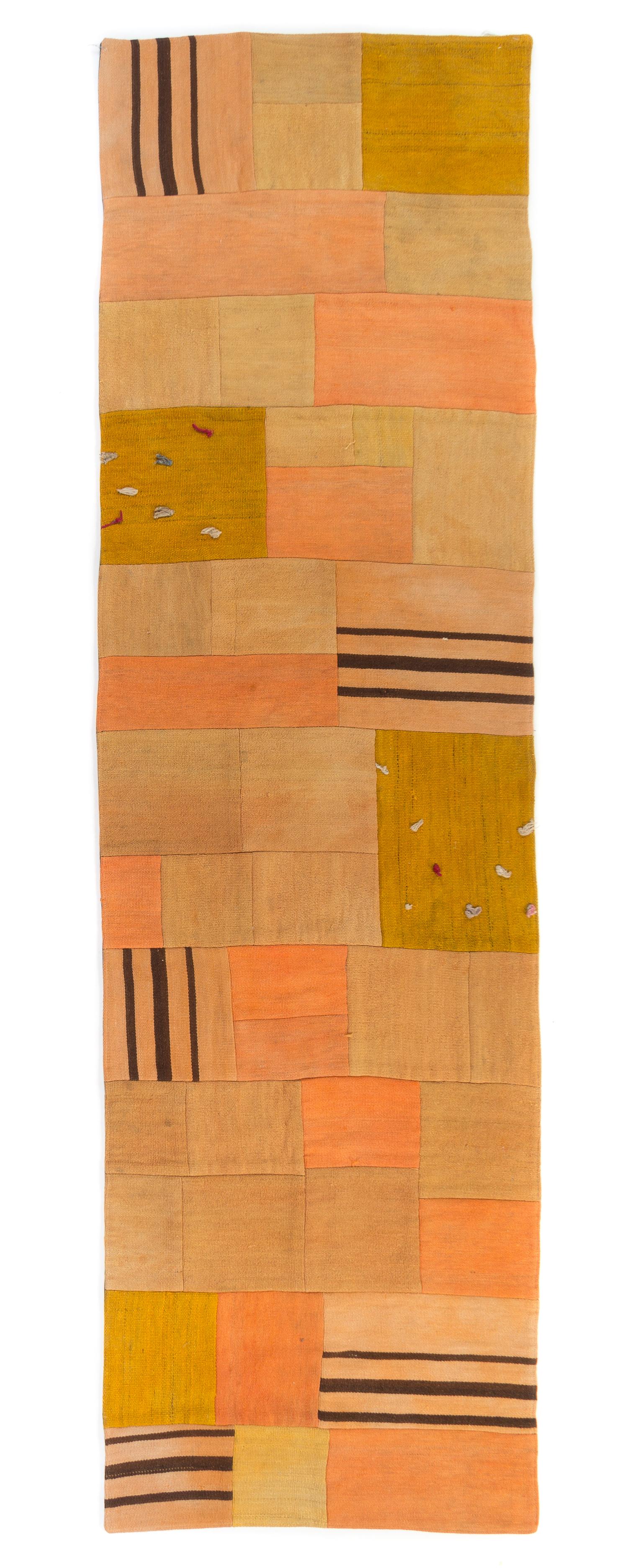 A Turkish Kilim Golden Patchwork Wool Rug 28 x 94 inches.