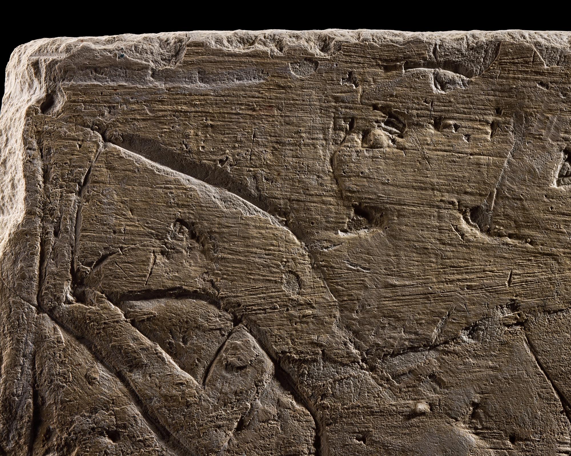 An Egyptian Limestone Relief Fragment Depicting an Offering Scene
