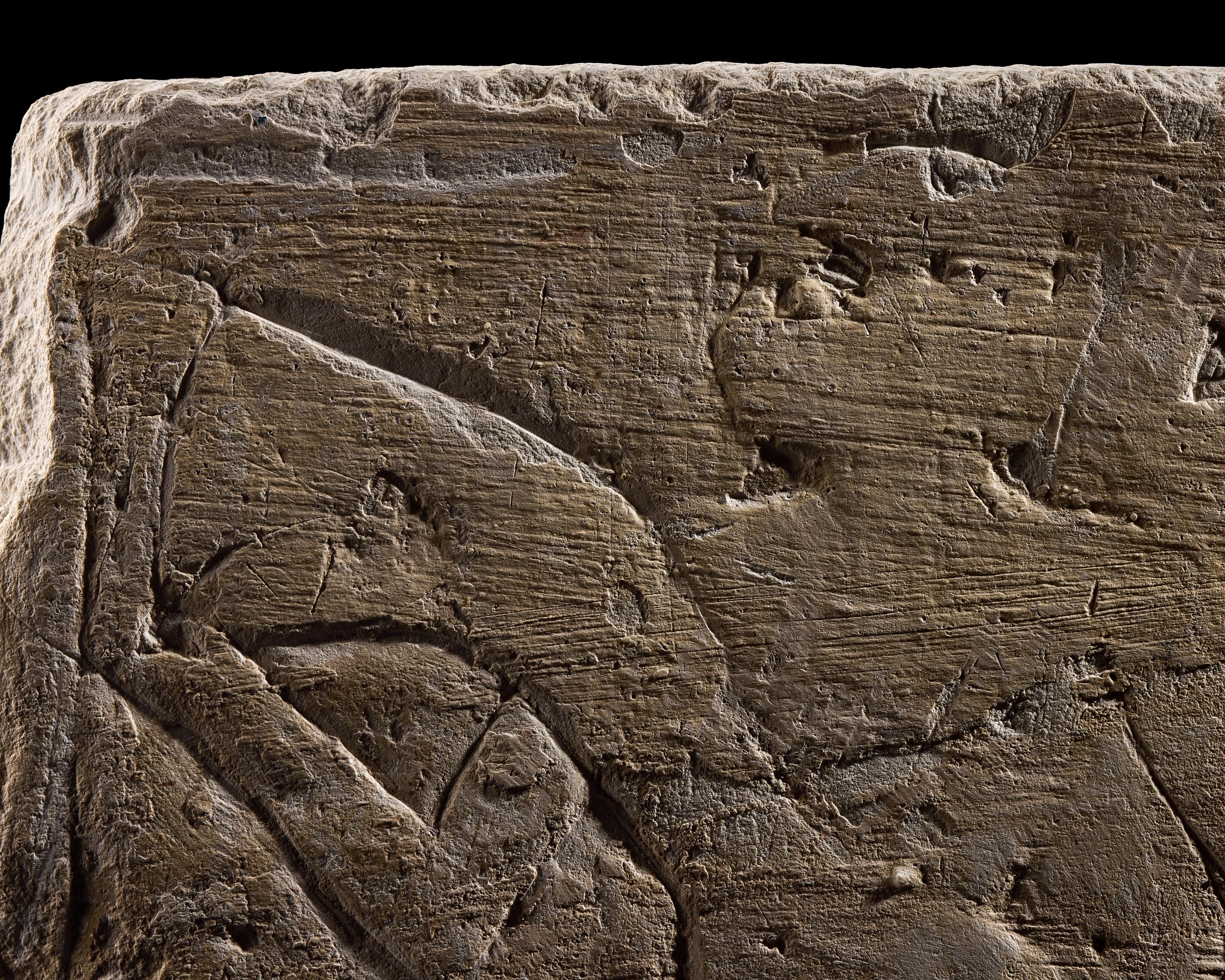 An Egyptian Limestone Relief Fragment Depicting an Offering Scene