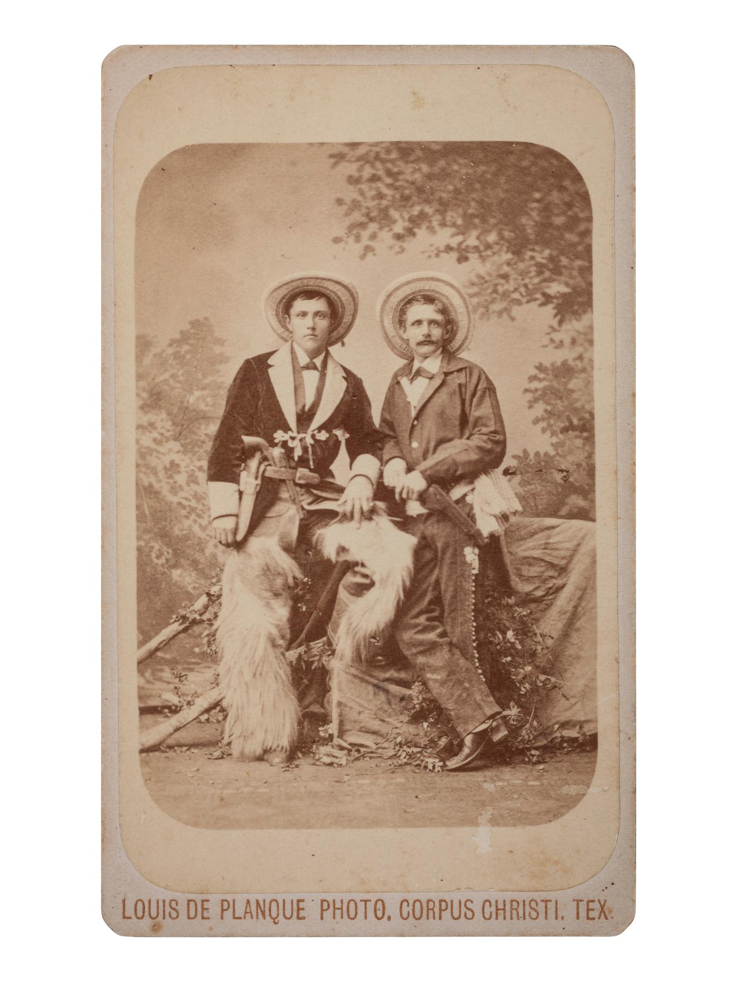 [WESTERN AMERICANA]. DE PLANQUE, Louis, photographer. CDV of two armed cowboys. Corpus Christi, TX: n.d.