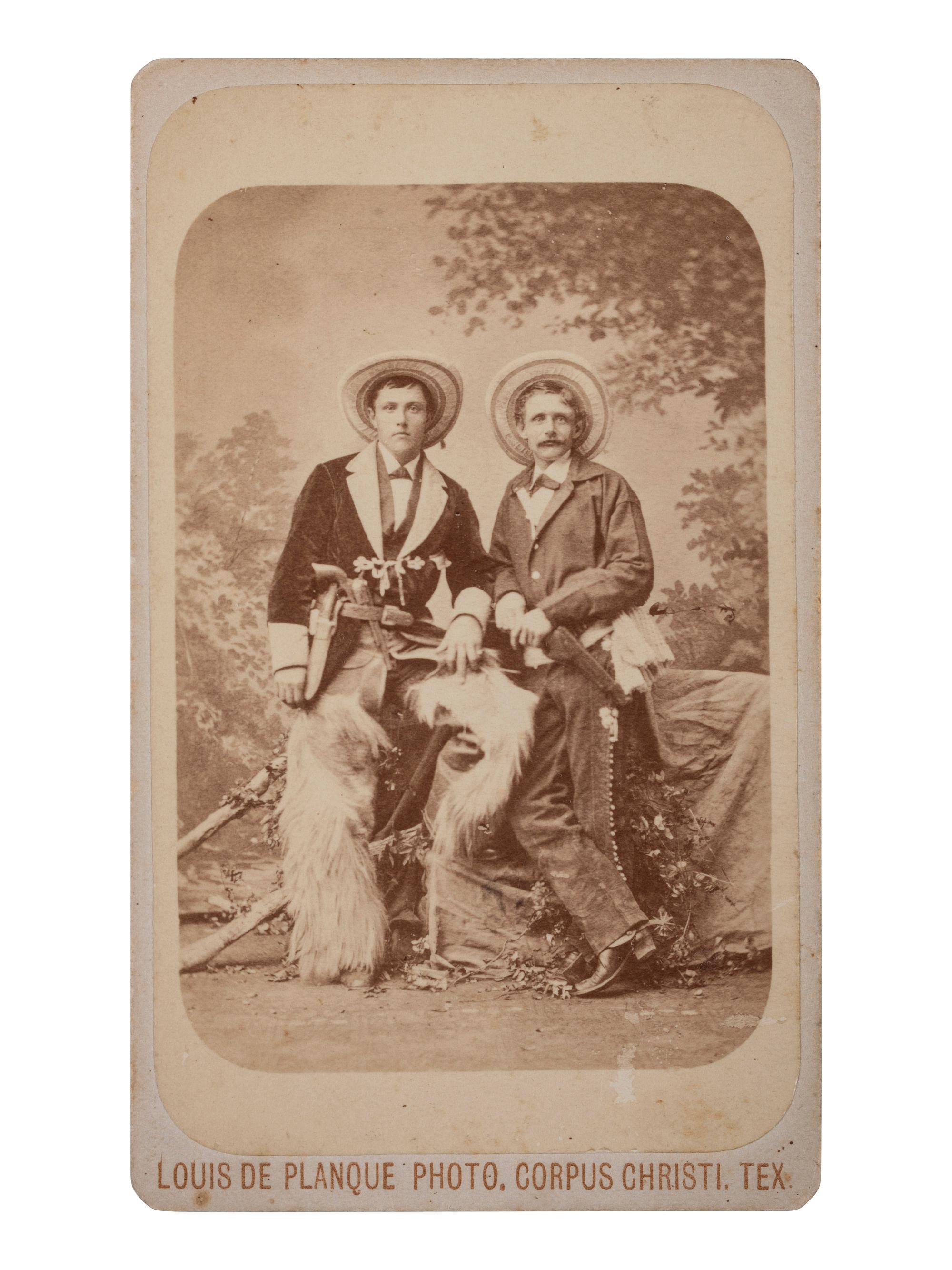 [WESTERN AMERICANA]. DE PLANQUE, Louis, photographer. CDV of two armed cowboys. Corpus Christi, TX: n.d.