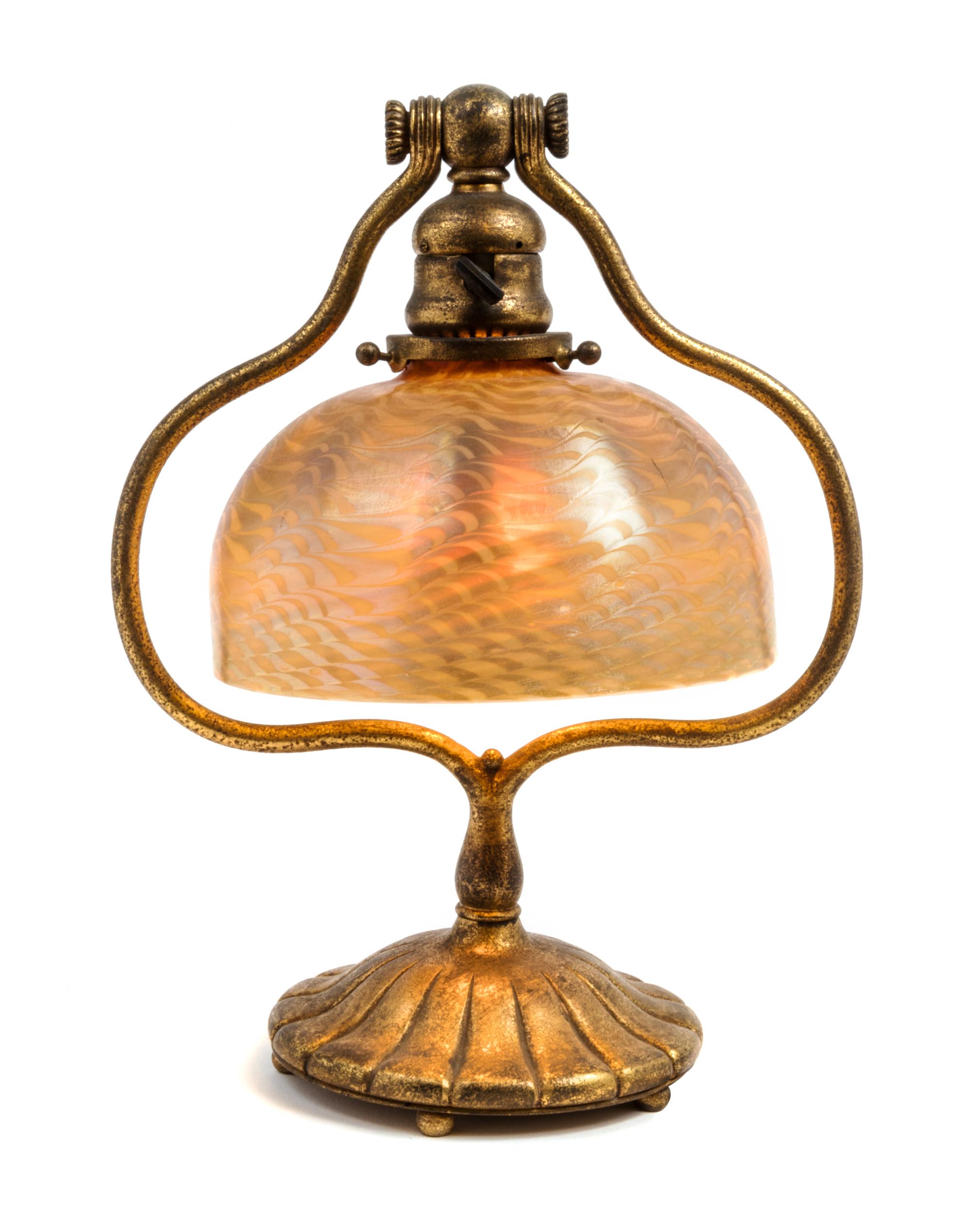 Tiffany Studios, EARLY 20TH CENTURY, a gilt bronze and Favrile glass desk lamp