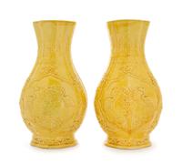 A Pair of Carved Yellow Glazed Porcelain Vases Height 11 1/2 inches. — 19TH CENTURY