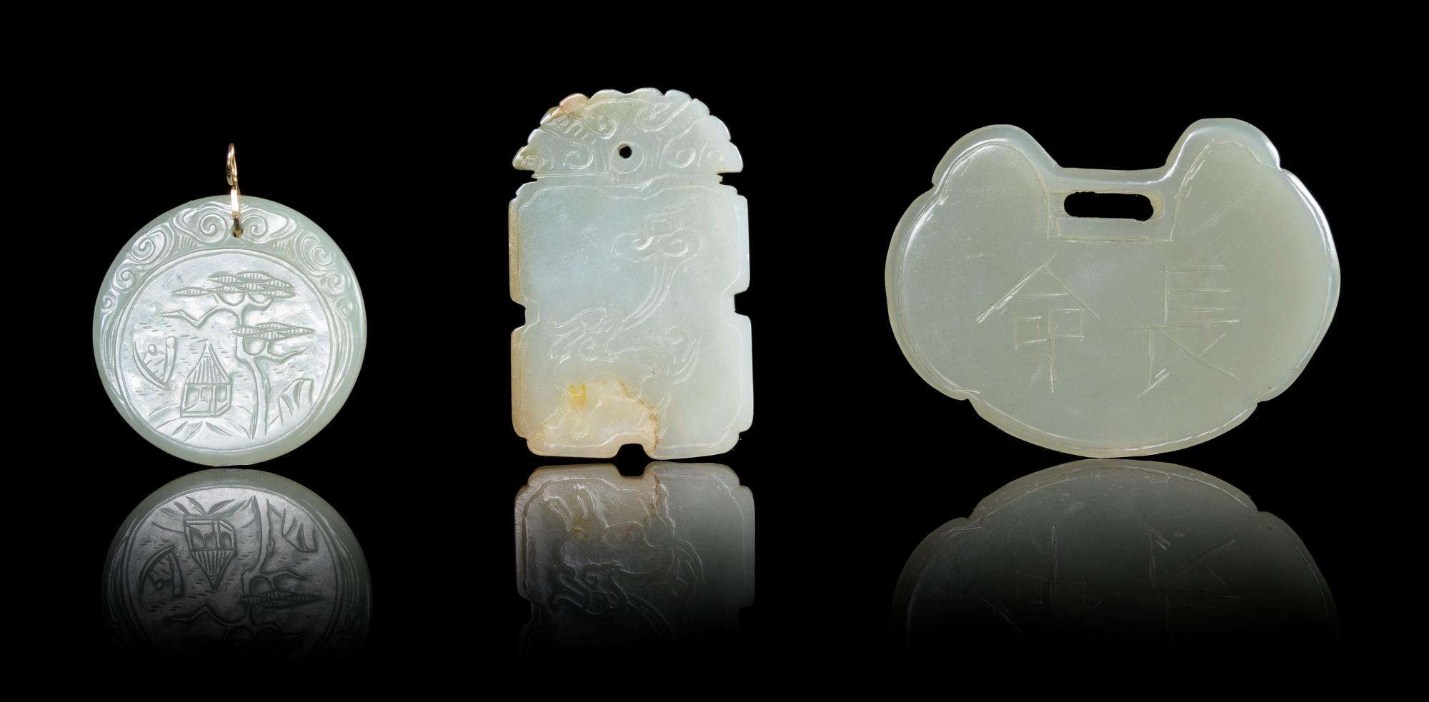 Three Celadon Jade Pendants Length of largest 3 inches x 2 1/4 inches.