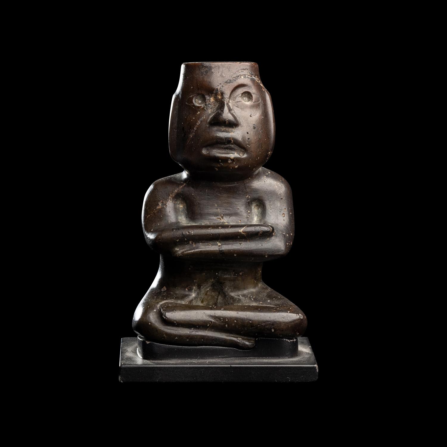 A Group of Twelve Pre-Colombian Style and Near Eastern Style Carved Stone Articles