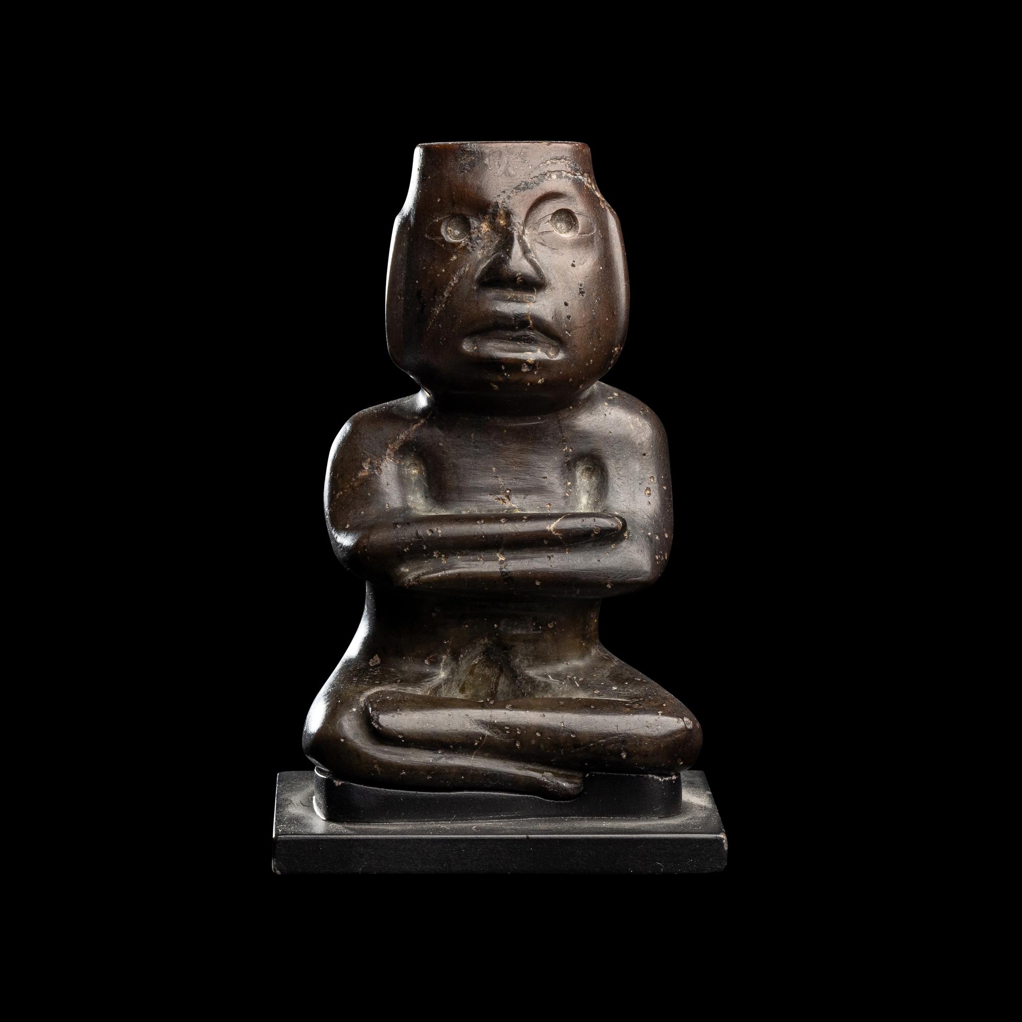 A Group of Twelve Pre-Colombian Style and Near Eastern Style Carved Stone Articles