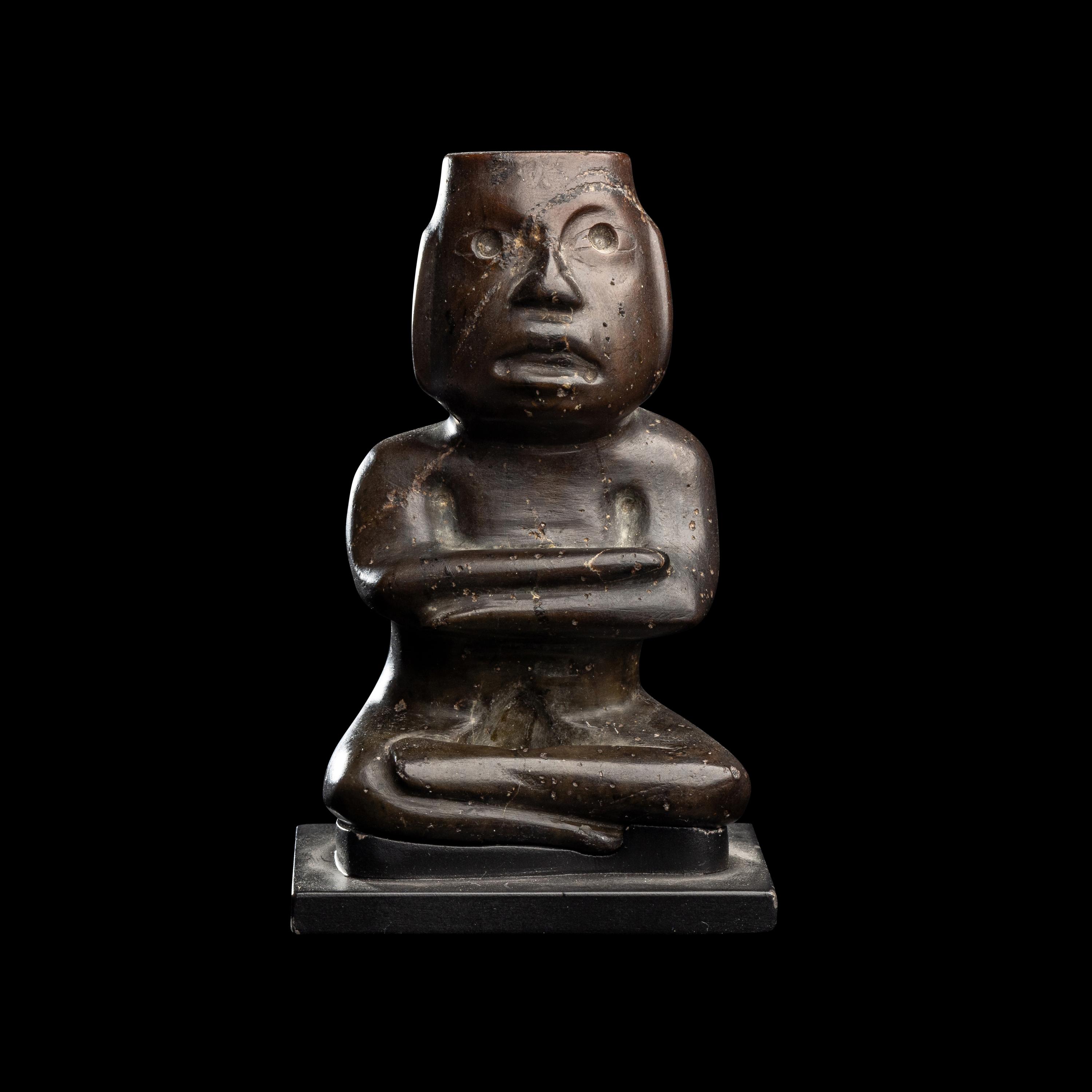 A Group of Twelve Pre-Colombian Style and Near Eastern Style Carved Stone Articles
