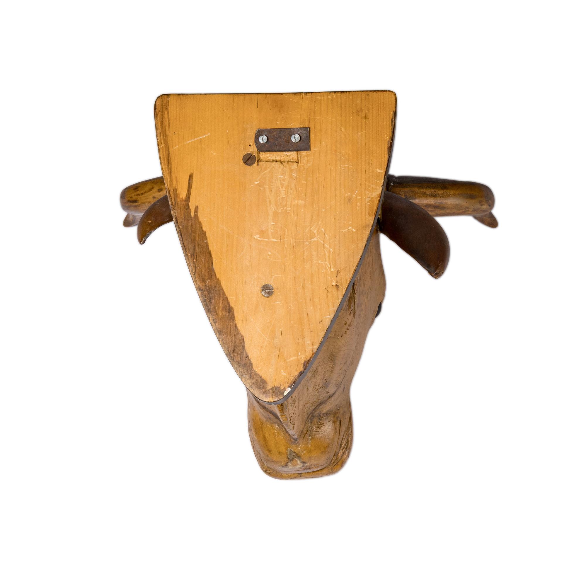 A Carved Wood Bull's Head Mount