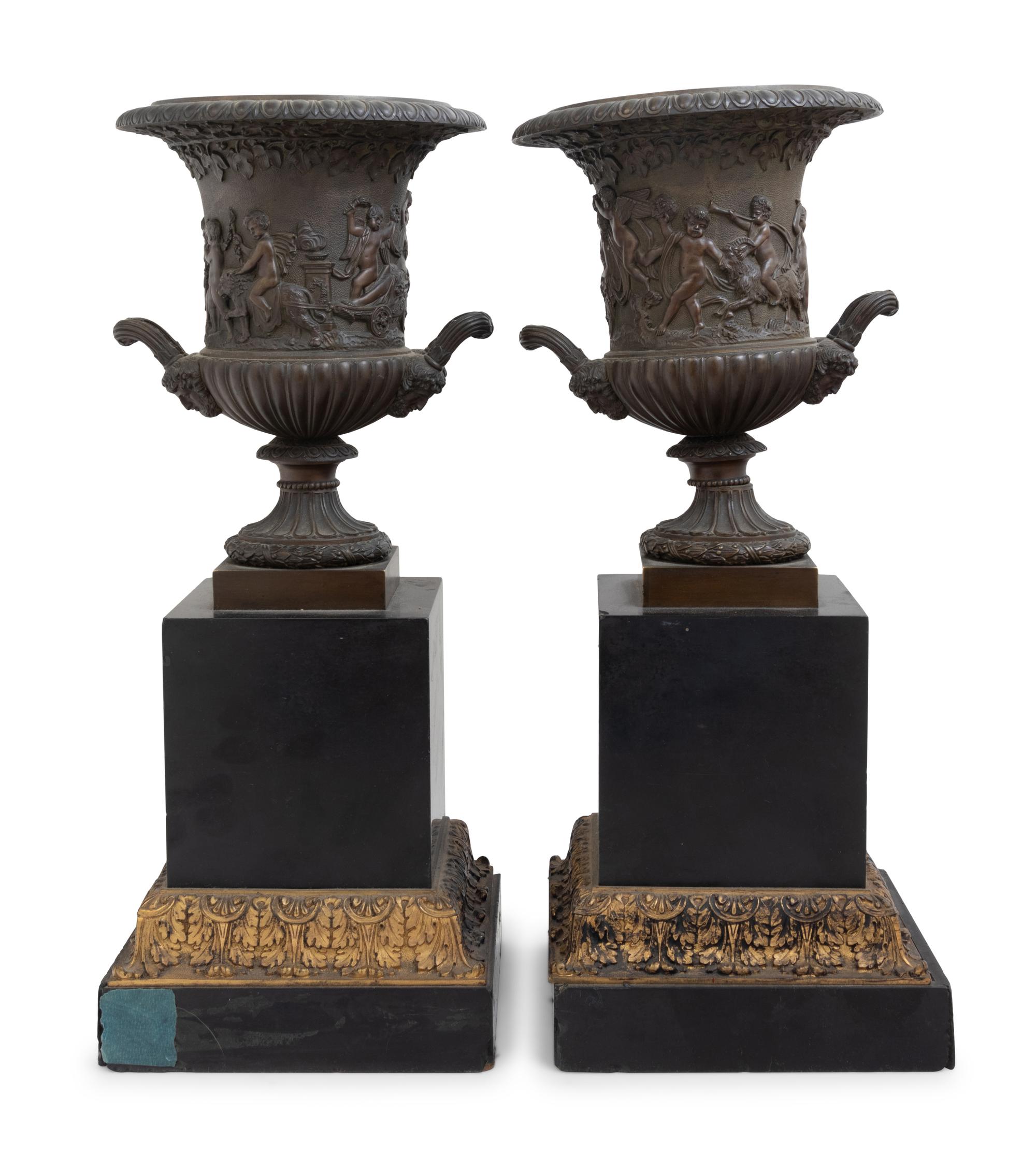 A Pair of Continental Bronze Urns with Associated Plinths
