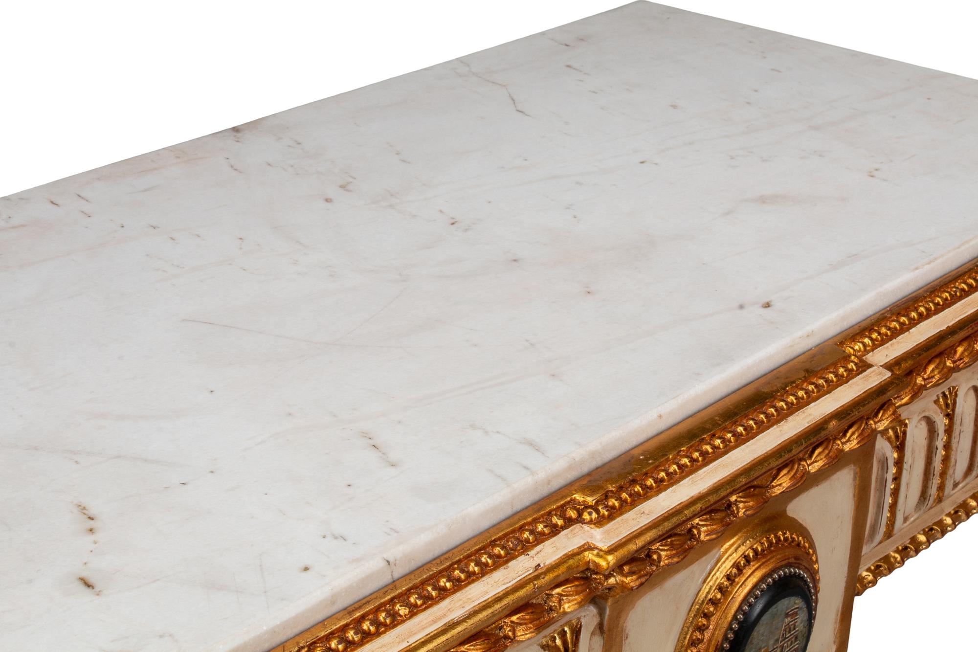 A Pair of Italian Neoclassical Style Cream-Painted, Parcel Gilt and Micro Mosaic Plaque-Mounted Console Tables