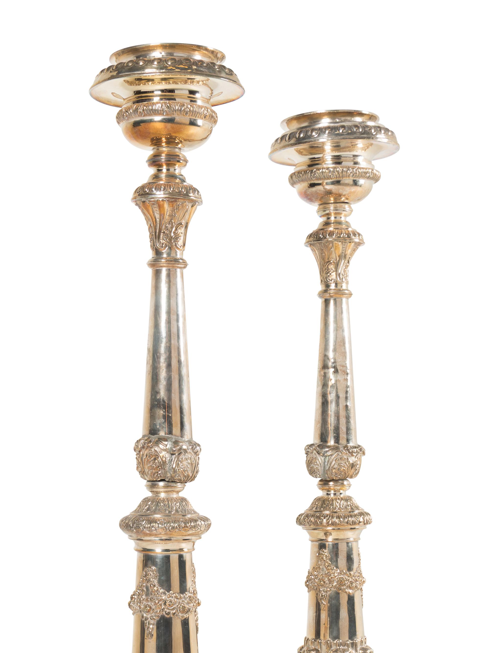 A Pair of Monumental Silvered Metal Altar Sticks