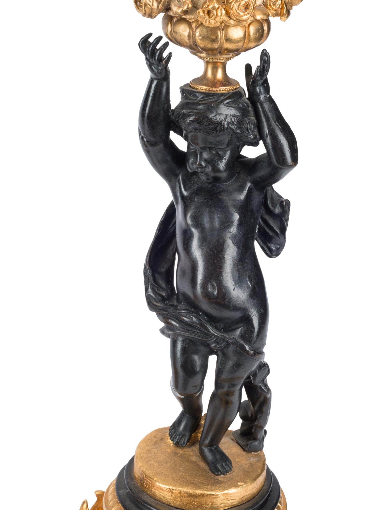 A Pair of French Gilt and Patinated Bronze Figural Six-Light Candelabra