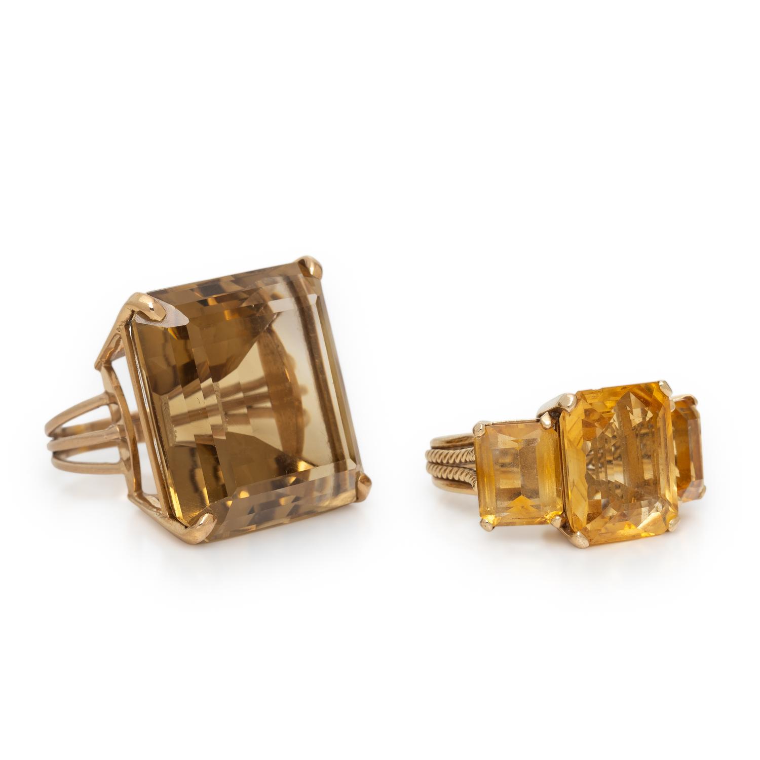 TWO CITRINE AND YELLOW GOLD RINGS