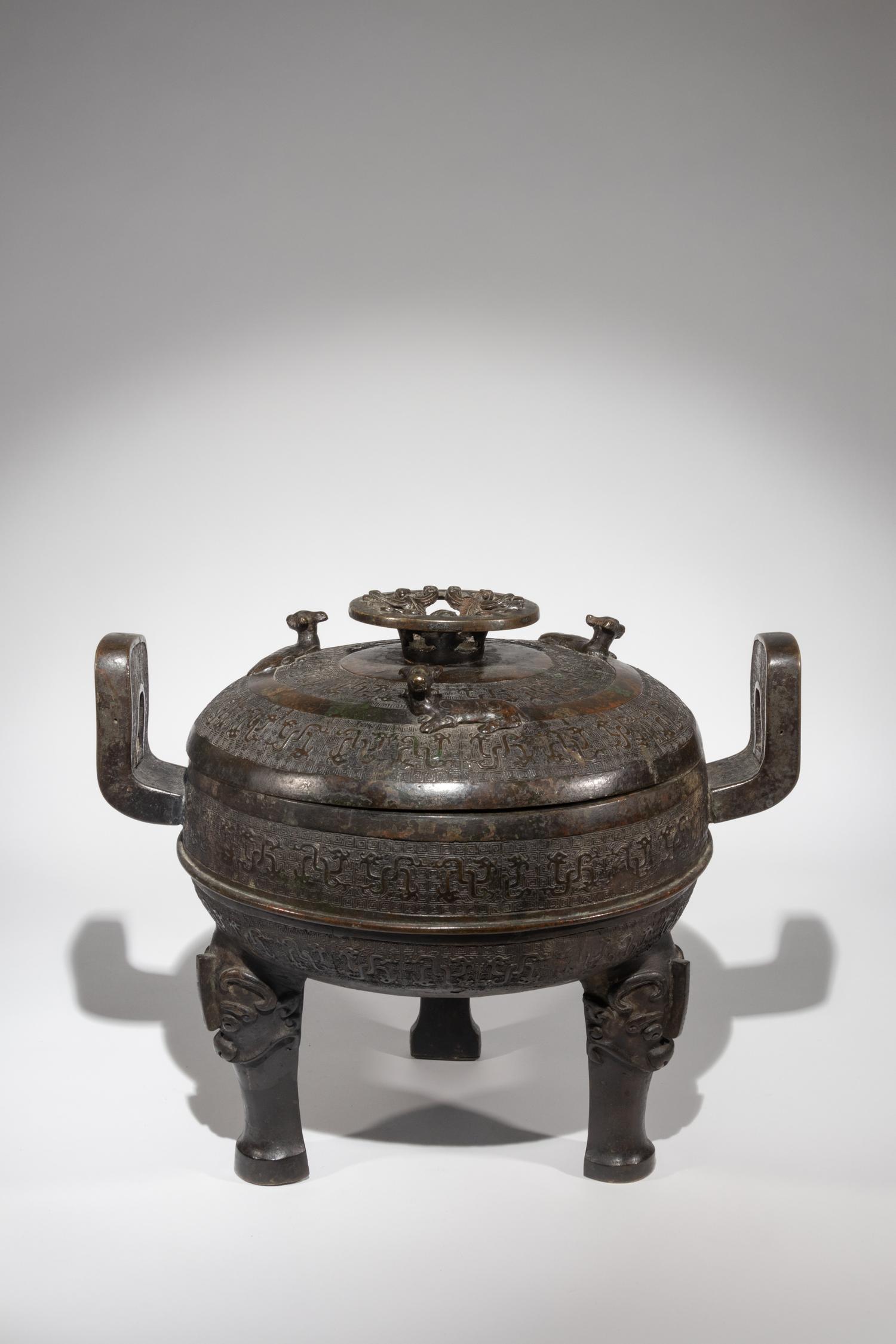 A Rare Archaistic Bronze Ritual Tripod Vessel and Cover, Ding