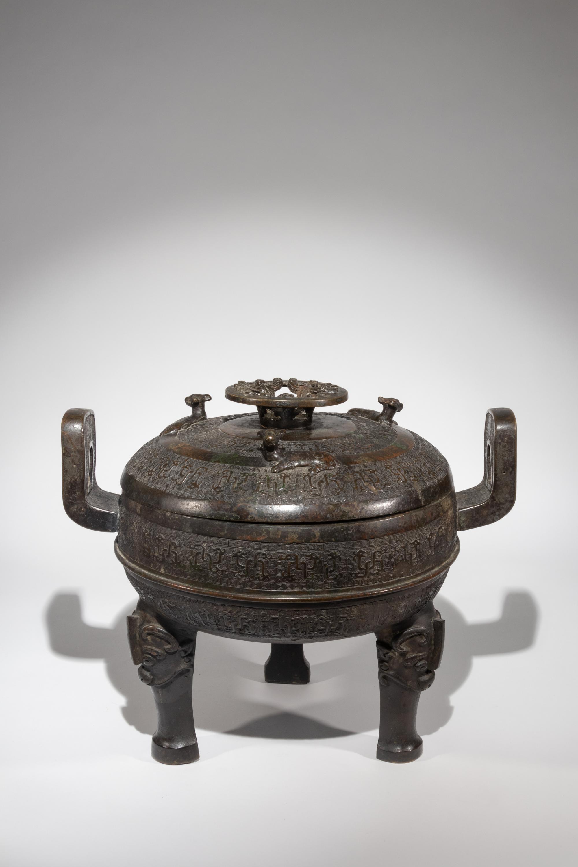 A Rare Archaistic Bronze Ritual Tripod Vessel and Cover, Ding