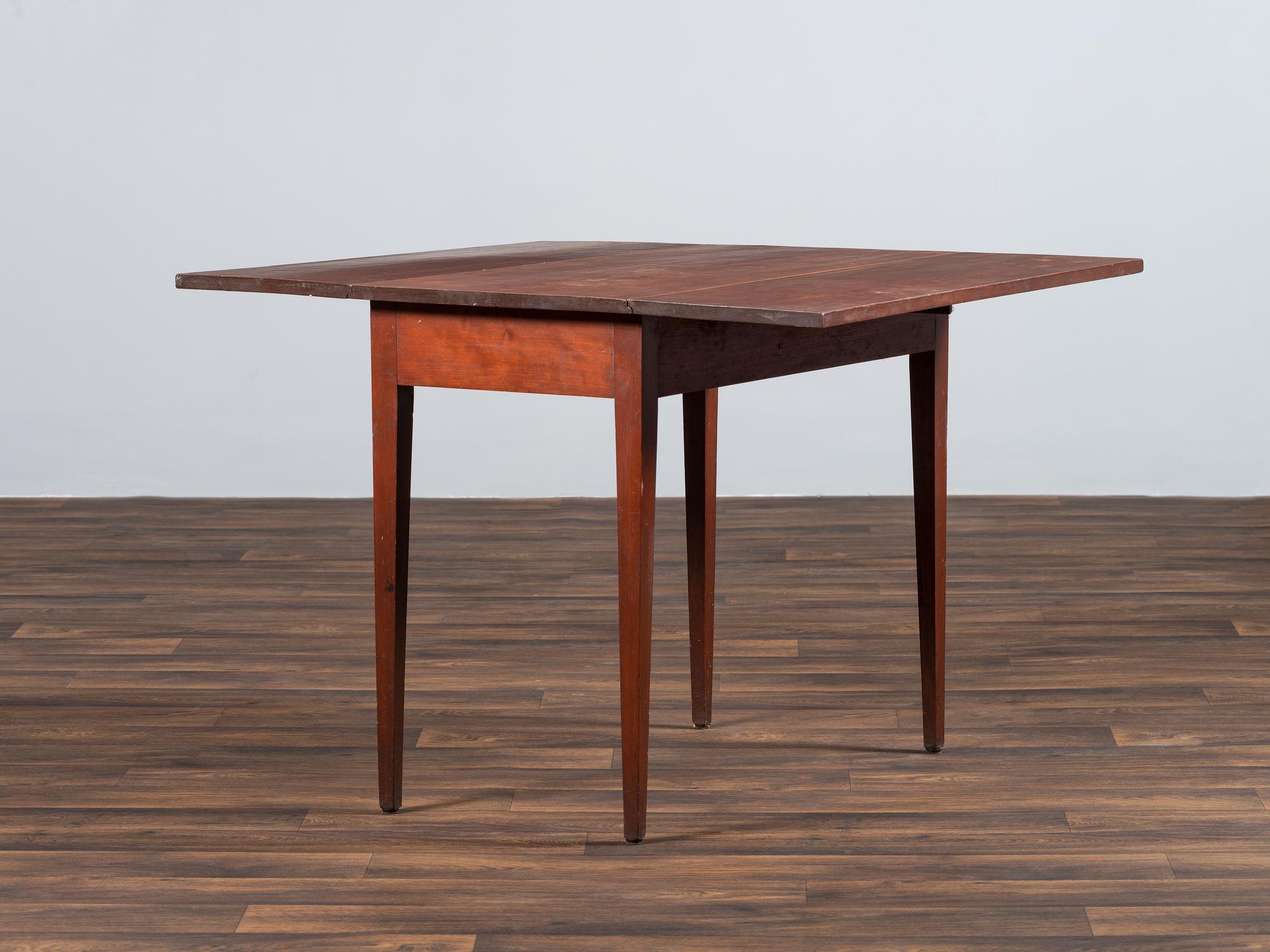 A Shaker Red-Stained Cherrywood Drop-Leaf Dining Table