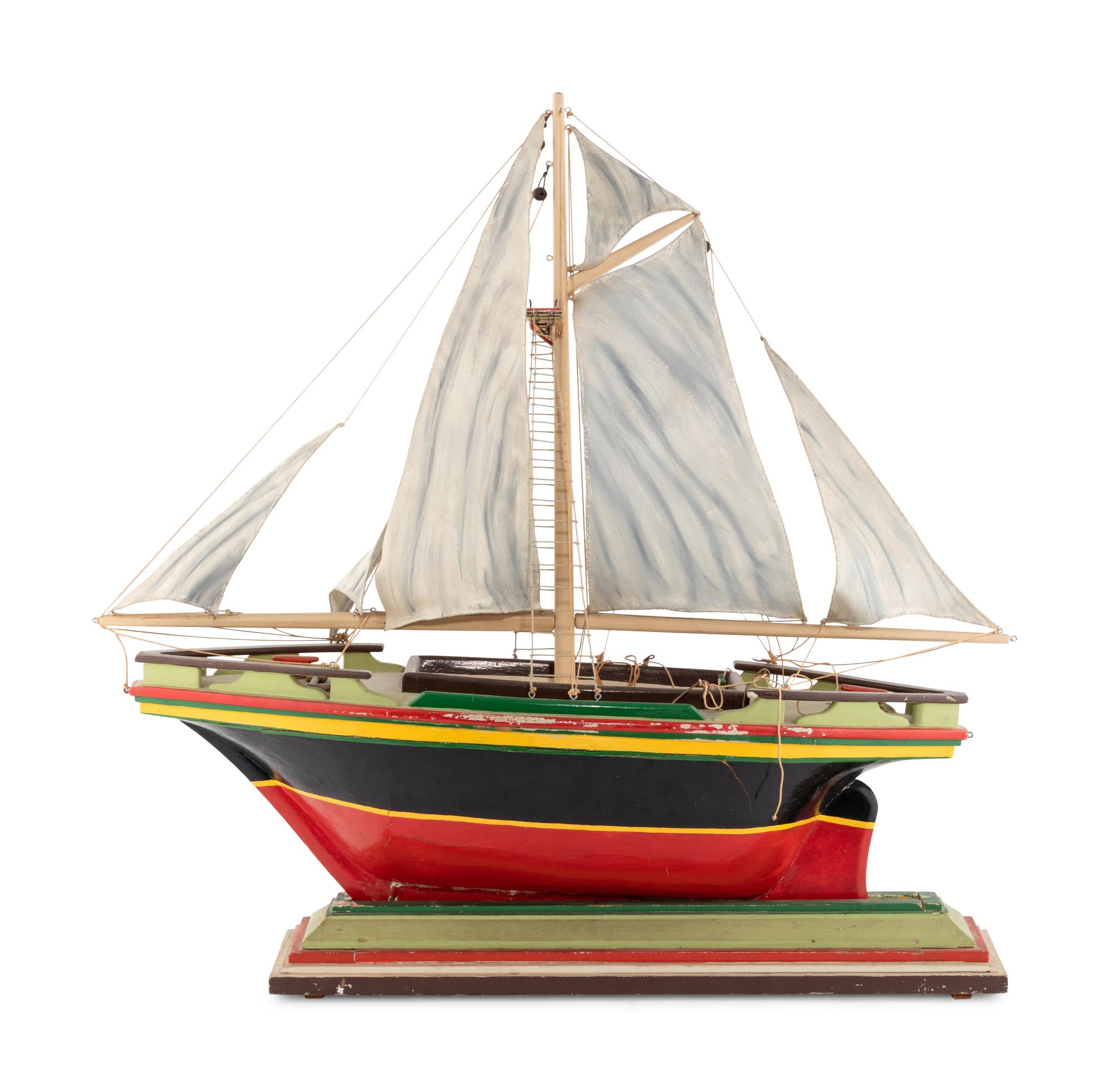 A Carved and Polychrome Painted Wooden Ship Model