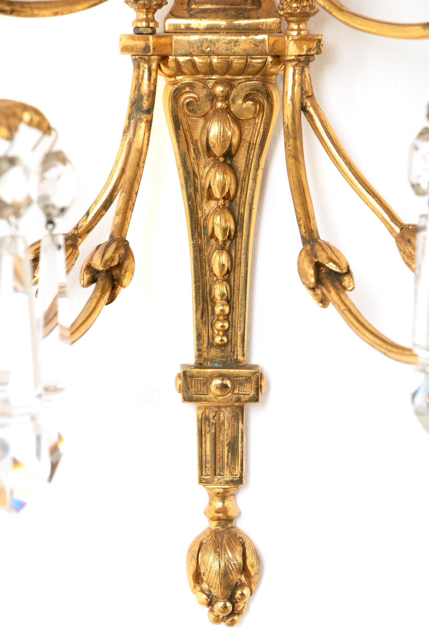 A Pair of Louis XVI Style Gilt Bronze and Cut Glass Nine-Light Sconces