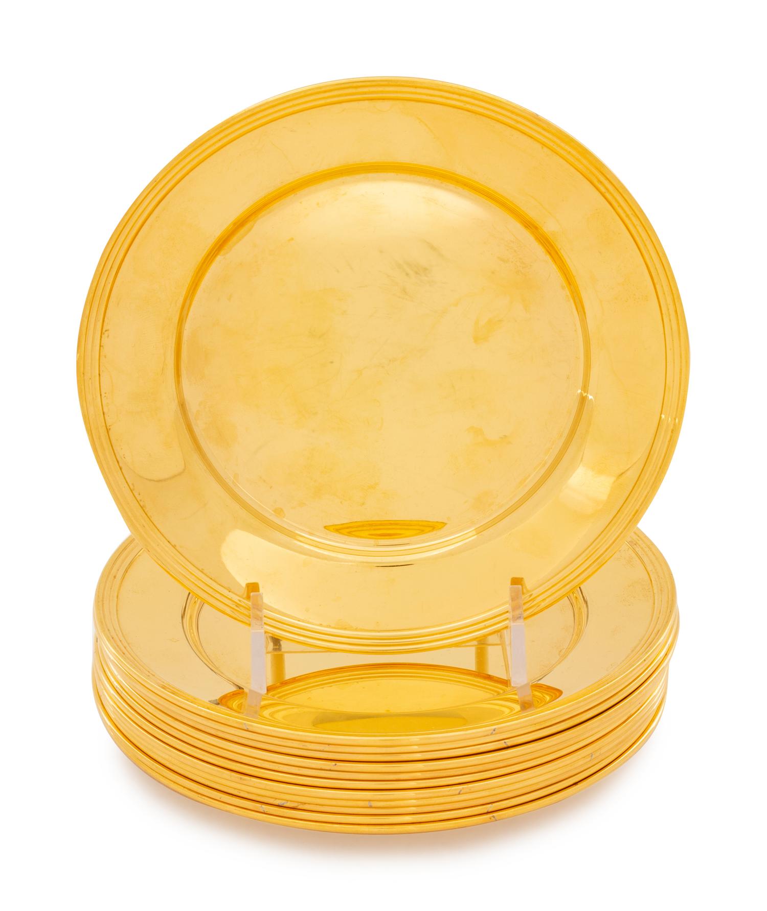 A Set of Twelve Gilt Silver Bread Plates