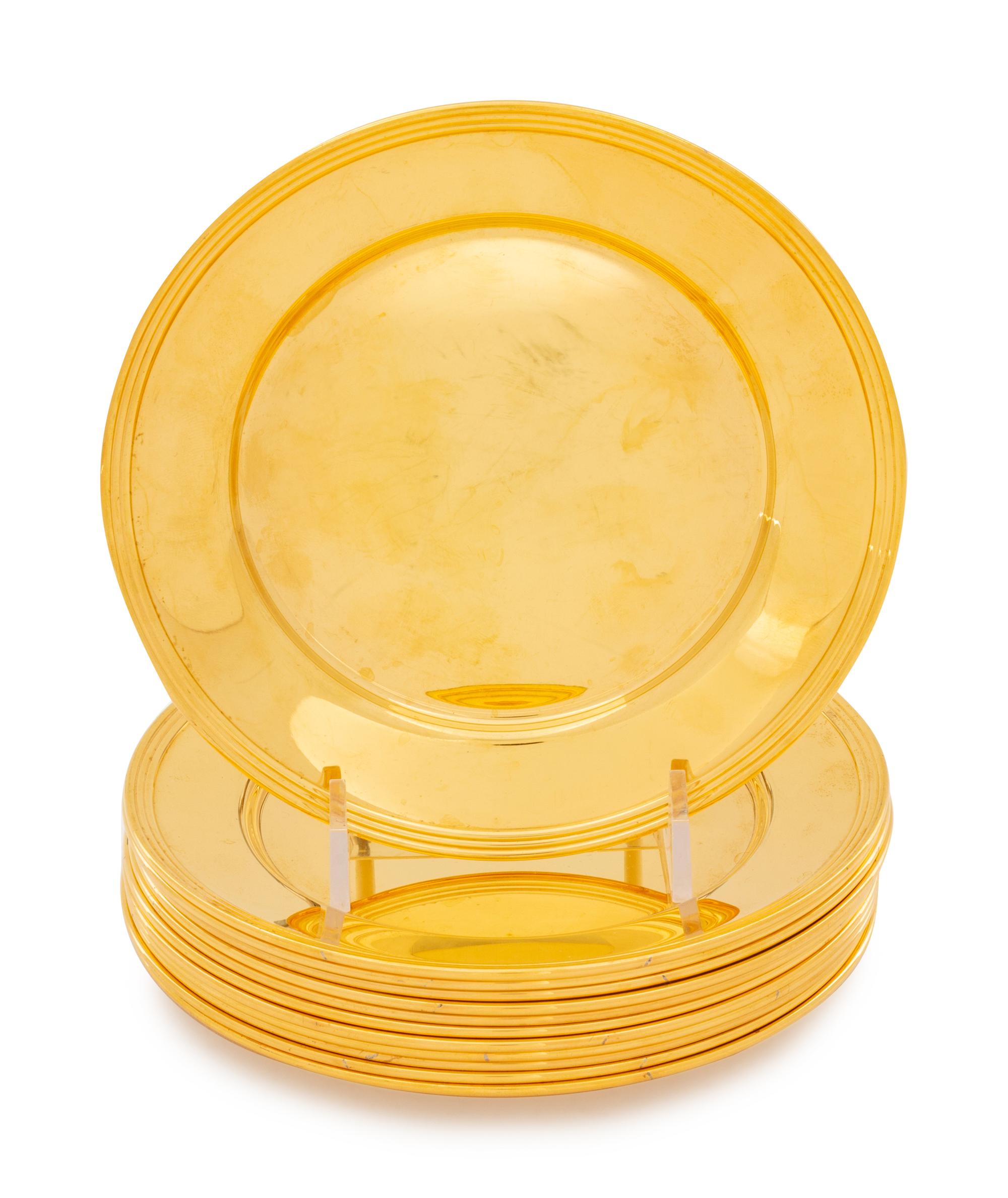 A Set of Twelve Gilt Silver Bread Plates