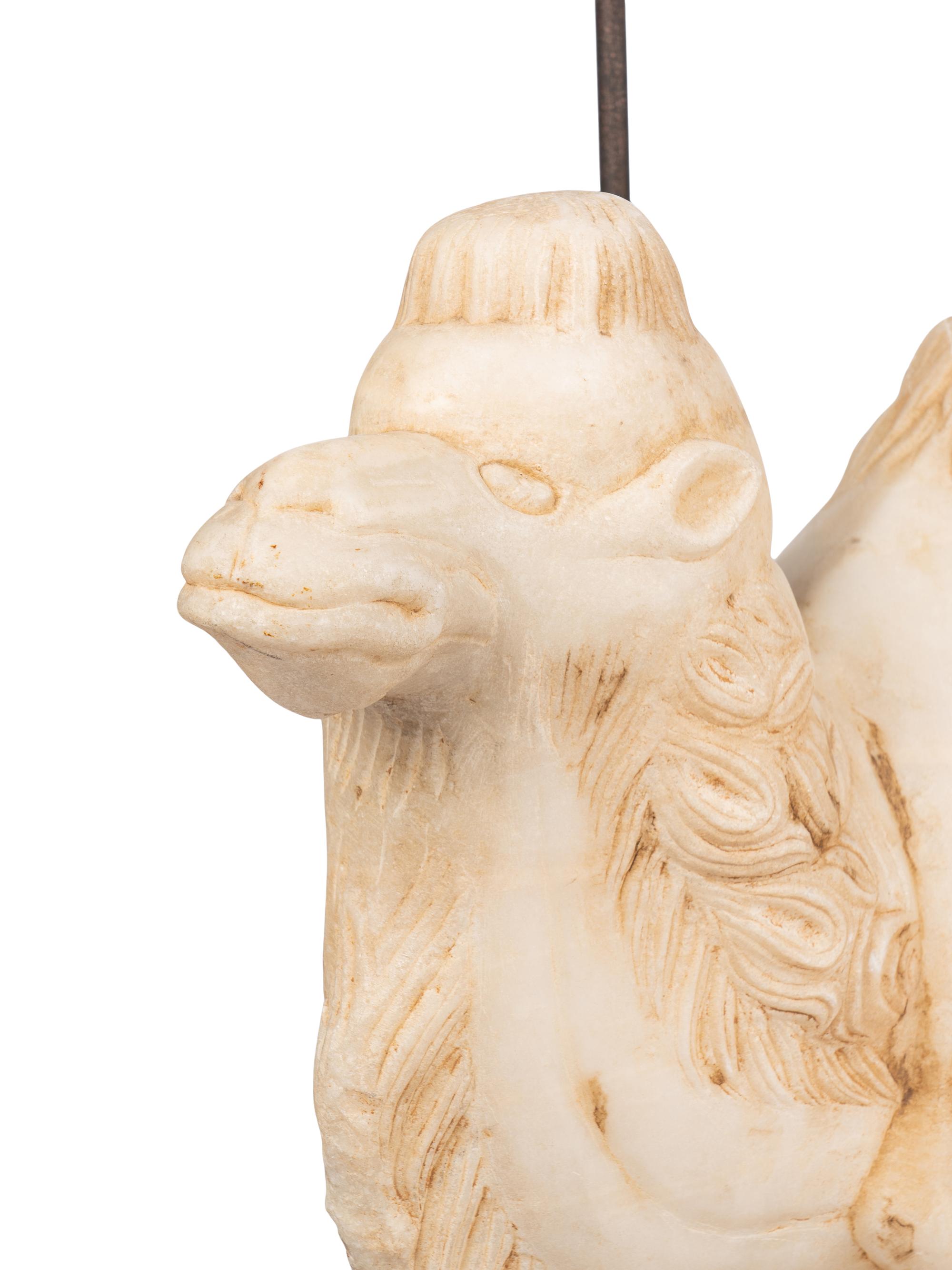 A Pair of Carved Marble Camels