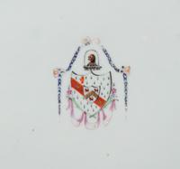 A Pair of Chinese Export Porcelain Armorial Platters Raised on Later Mahogany Stands