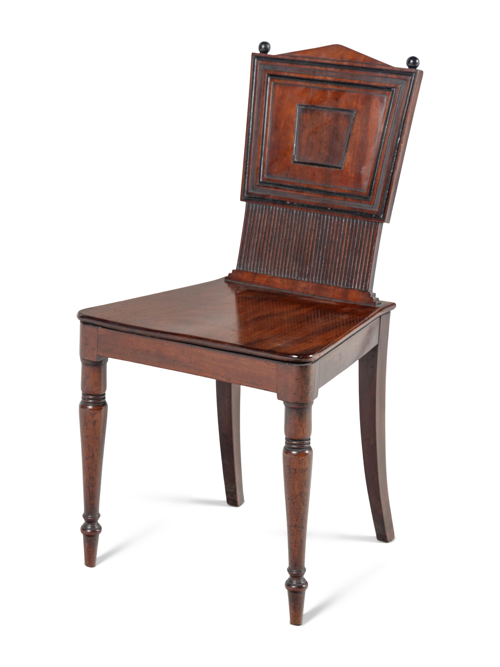 A Pair of William IV Carved Mahogany Hall Chairs